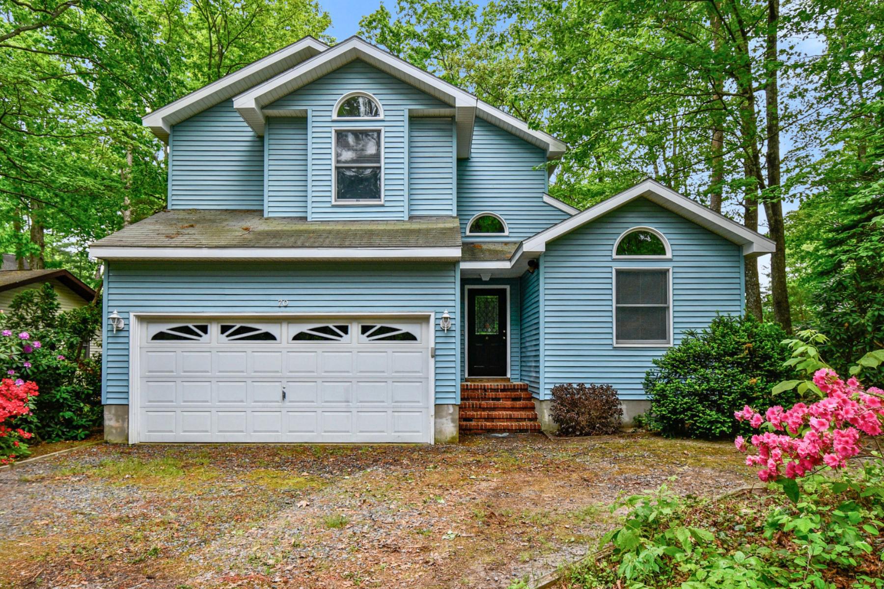 If you are looking for space, you’ve found it in this home nestled on a serene wooded lot in Ocean Pines!  This two-story home features 4 bedrooms, 3 full baths, a 2-car garage, and a versatile sunroom.   The bright and airy living space boasts soaring ceilings and tons of windows that allow natural light to fill the inside.  The thoughtfully designed floorplan includes a main-level primary bedroom with en-suite bath and spacious walk-in closet.  Upstairs you will find three additional bedrooms each with large closets.  Bonus…there is easy access to a large floored attic for extra storage. Outdoor living is just as inviting, with an enormous deck overlooking the private backyard — the perfect spot to relax or entertain after a day at the beach. The yard also features a powered storage shed for hobbies, tools, or extra workspace. Freshly painted throughout, the home is clean, bright, and move-in ready. While some TLC and updates could further enhance its value, the home is priced with that in mind. Sellers are also offering a $5,000 credit toward new appliances!  Savvy investors can enjoy this property immediately and make updates over time adding tremendous value!