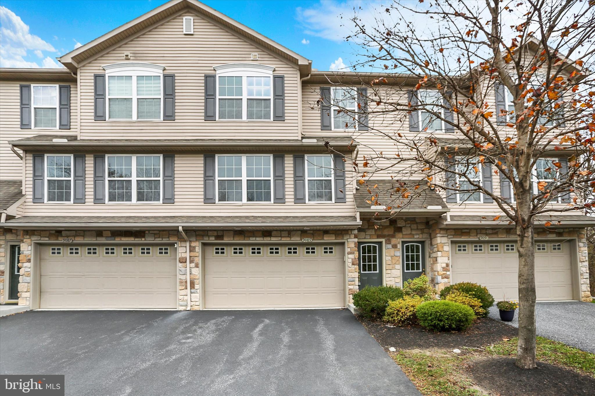 Well-maintained move-in ready townhome with 2 car garage! Foyer leading up to a living room, half bath, open kitchen with stainless steel appliance package and island, dining room with sliders to deck for relaxing. Bright colors throughout. Second floor with primary bedroom, private full bath, and walk-in closet, plus 2 additional bedrooms, full bath, and laundry. Put this on the must see list!