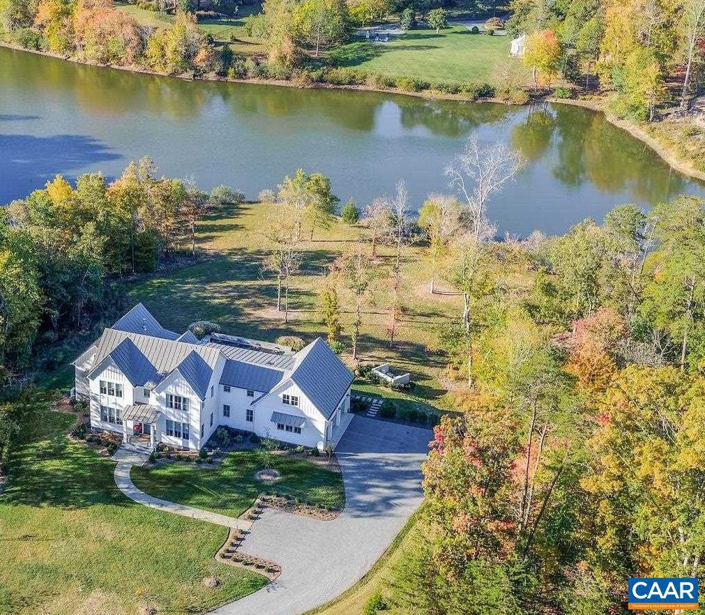 Sited overlooking Broadmoor Lake in coveted Keswick Estate & completed in 2024, this custom 4 bedroom residence might be the 1st opportunity to purchase a revered, truly bespoke new home by Uhler Construction. The owners have built many houses over the years working w/ top notch architects & builders.  Resultingly, they have created an amazing 1st floor living plan with no detail overlooked in fit, finish or functionality. As one enters the house, the views of the sparkling lake beyond the gorgeous salt water pool are the 1st impression. The dramatic yet intimate impact of the home is further enhanced by generous proportions, high ceilings (vaulted in the main living space, primary)  & oversized windows for incredible natural light. Striking finish selections incl' dramatic & varied marble & quartz selections in kitchen & baths, Philip Jeffries wallpaper, lovely custom window treatments, white oak, wide plank hardwood floors, furniture-grade cabinetry throughout the home, 130 bottle wine fridge, Lutron lighting system, oversized gas fireplace in the family room, built-in gas & charcoal grill by the pool. See attached document for all details.  Truly, no stone unturned or expense spared in creating this dramatic, welcoming home.,Quartz Counter,White Cabinets,Fireplace in Family Room,Fireplace in Master Bedroom