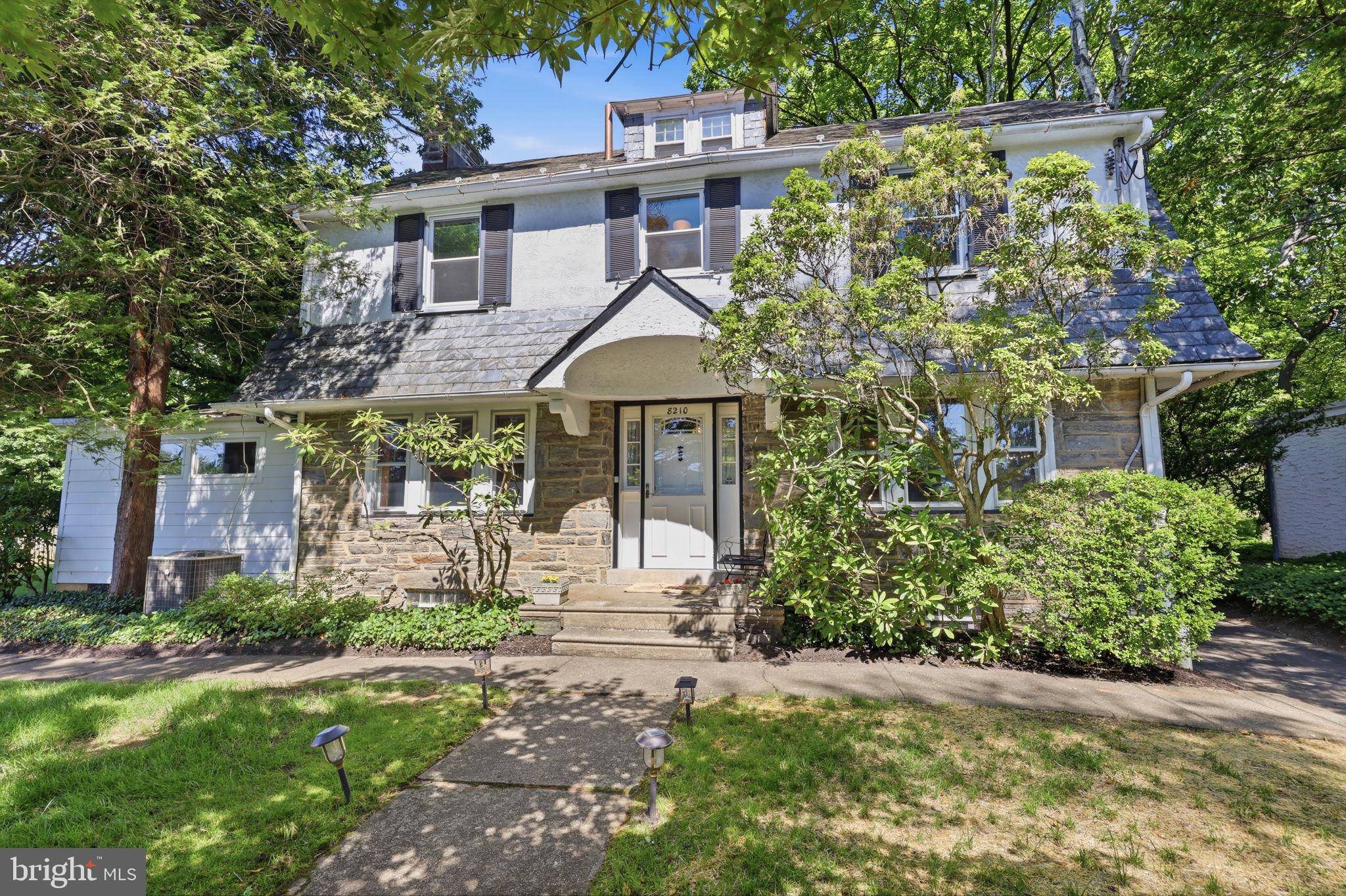 Welcome to 8210 Fairview Road, a classic Colonial set on an exceptional half-acre double lot in the heart of Elkins Park. Offering over three levels of living space, generous room sizes, and a flexible floor plan, this home presents a rare opportunity to enjoy both the character of a traditional Colonial and the space that is increasingly difficult to find.

Inside, you'll find a layout designed for both everyday living and entertaining. The formal living and dining rooms provide spacious gathering spaces, while a substantial family room addition creates a bright and comfortable hub for daily life;  surrounded by windows and featuring radiant heated floors, the inviting space offers beautiful views of the side and backyards and plenty of room to relax, work, or host guests.

The kitchen was thoughtfully expanded and remodeled with custom cherry cabinetry, premium appliances including a Sub-Zero refrigerator, Dacor wall oven and built-in microwave, Wolf cooktop, steamer, Moen water filter, cleverly built storage nooks and cabinets and a comfortable eat-in area. Whether preparing a weeknight meal or hosting a holiday gathering, the kitchen offers the space and functionality serious cooks will appreciate.

The second floor includes three bedrooms and two full baths, including a primary suite with its own private bathroom. A standout feature is the spacious home office addition, where vaulted ceilings and abundant natural light create an inspiring setting for remote work, artistic pursuits, or a quiet space to relax.

The third floor adds even more versatility with an additional bedroom, full bath, and unfinished storage space.

Outside, the expansive double lot provides an abundance of open lawn space for recreation, gardening, pets, or whatever you can imagine. A detached garage, large patio and mature landscaping further enhance the property's appeal.

Conveniently located near parks, shopping, restaurants, regional rail, and all that Elkins Park has to offer, 8210 Fairview Road combines classic architecture, generous living space, and an unusually large homesite in one of the community's most established neighborhoods.