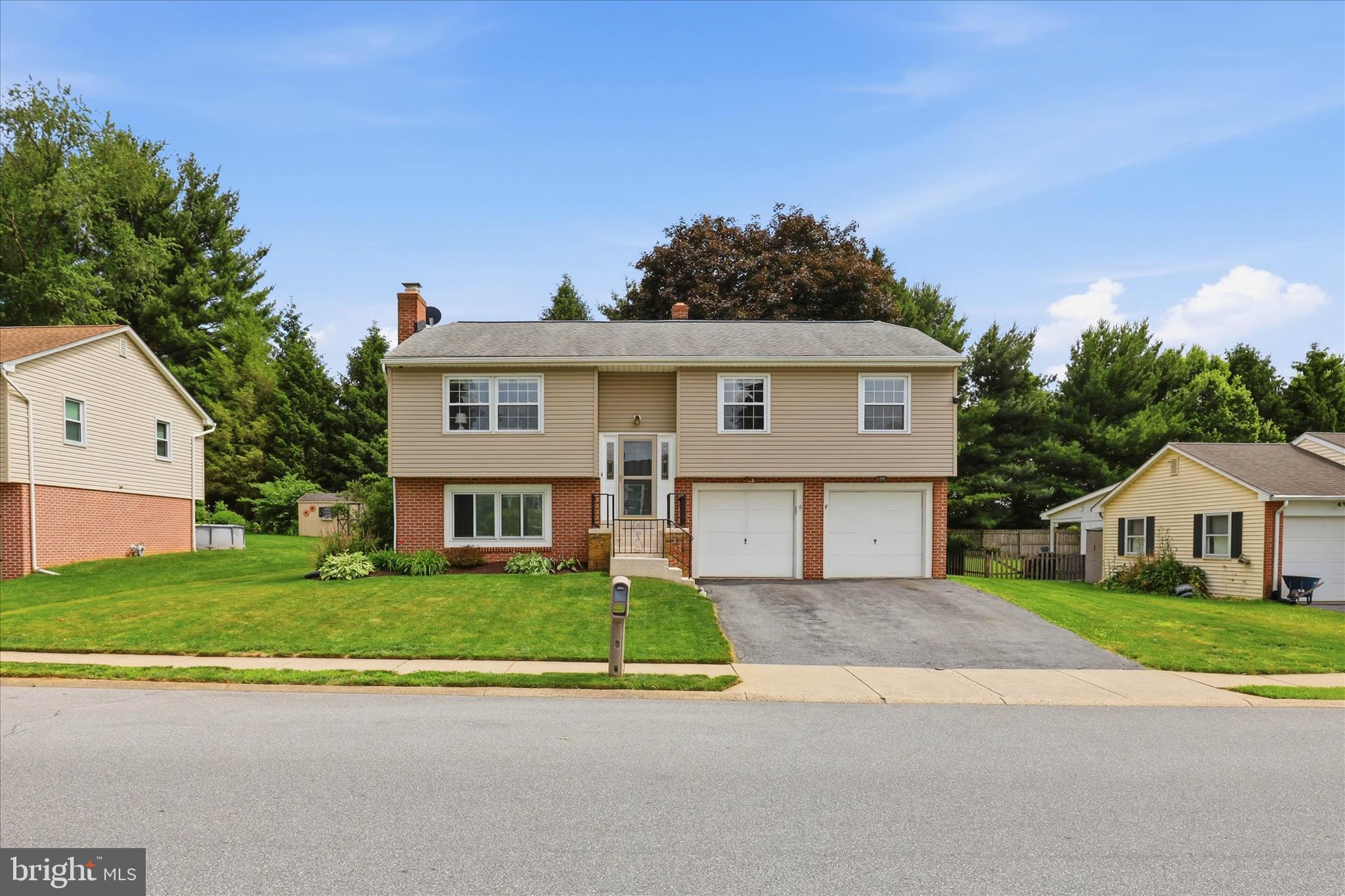 Welcome to 520 Wallingford Dr, a beautifully updated bi-level home in the highly sought-after Manheim Township School District—where homes priced under $425,000 are a rare find. Tucked into the desirable School Valley Farms neighborhood and set in the center of the county, this home offers exceptional convenience with easy access to major roadways, shopping, dining, and everyday essentials, all while backing up to a peaceful walking trail. Built in 1974 and offering 1,814 square feet of comfortable living space, this move-in ready home shines with thoughtful updates throughout. Since 2024, it has been refreshed with brand-new LVP flooring and carpet throughout, fresh paint from top to bottom, and a stylish new kitchen backsplash that adds the perfect finishing touch. The result is a bright, modern, and inviting atmosphere ready for its next owner to simply move in and enjoy. The home offers three bedrooms and two and a half bathrooms, including a primary bathroom—a feature that's exceptionally rare for a bi-level and a true everyday luxury. The updated tile master shower elevates the space, offering a spa-like retreat to start and end your day. Downstairs, a refreshed bathroom features new drywall, a new vanity, and a new toilet, adding even more value and comfort. Step outside to a backyard that backs directly up to a walking trail—offering a quiet, scenic connection to the outdoors right beyond your back door. Whether you're enjoying a morning walk or unwinding after a long day, this setting delivers a rare blend of privacy and accessibility. A two-car garage completes the package, providing ample parking and storage. With its unbeatable location, rare updates, and a price point that's hard to find in Manheim Township, this home is a standout opportunity. Come see everything 520 Wallingford Dr has to offer—schedule your private tour today.