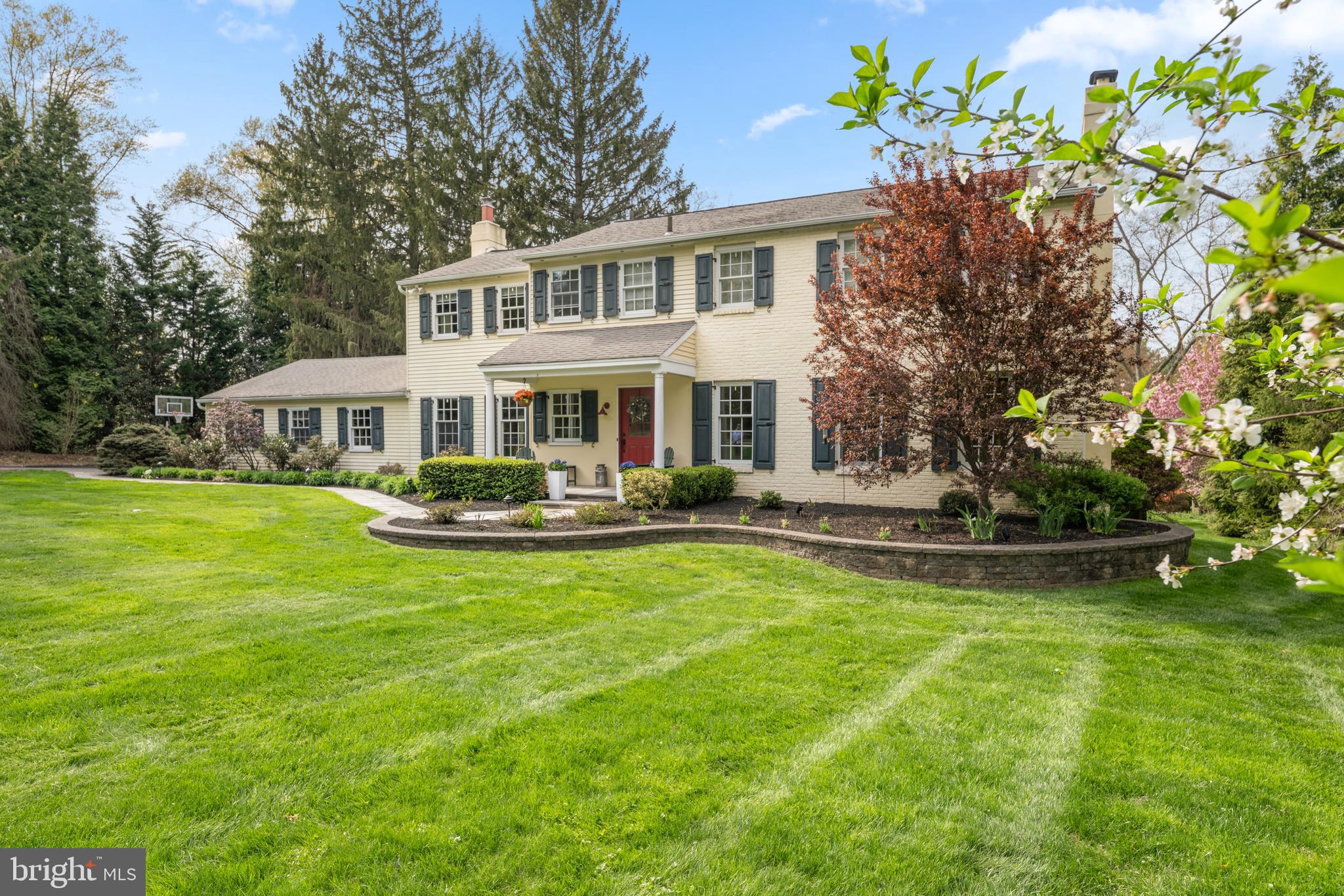 Welcome to 2 Gunning Lane, a classic Colonial residence tucked away on a private cul-de-sac lane in the heart of Gladwyne, within the highly regarded Lower Merion School District. Offering a seamless blend of timeless architecture and comfortable modern living, this 4-bedroom, 3.5-bath home is designed to accommodate both everyday life and year-round entertaining. Set on beautifully landscaped grounds, the property features a lush, level 1 acre yard framed by mature plantings and thoughtfully designed hardscaping. A tiered rear patio creates the perfect backdrop for outdoor dining, gatherings, or simply enjoying the peaceful surroundings. Inside, generously sized rooms provide a sense of space and ease throughout the home. The layout is both functional and inviting, with ample room for family living as well as hosting guests. First floor includes a welcoming 2 story foyer, a fireside living room and the formal dining room with chair rail and crown molding is the ideal setting to host holiday meals. The adjacent eat-in kitchen with center island offers terrific cabinetry space, stainless steel appliances, granite counters and a breakfast room overlooking the beautiful rear yard. Enjoy relaxing in the spacious family room boasting another fireplace and access to the extensive rear patio. A convenient laundry room, hall powder room and access to the garage complete this well designed living level. Upstairs offers a private primary bedroom suite with a walk-in closet and an updated bath including a double sink vanity and oversized shower. The three additional bedrooms are all terrific sizes and this floor provides two additional full hall bathrooms.  The finished lower level adds valuable flexible space—ideal for a home gym, playroom, or private office.  An unfinished area is quite useful for one's storage needs. This home’s location offers effortless access to Center City Philadelphia, major roadways, nearby amenities, boutique shopping and terrific restaurants making daily commuting and weekend outings equally simple and enjoyable. Refined yet welcoming, 2 Gunning Lane presents a wonderful opportunity to enjoy privacy, comfort, and classic Main Line living in a coveted Gladwyne location.