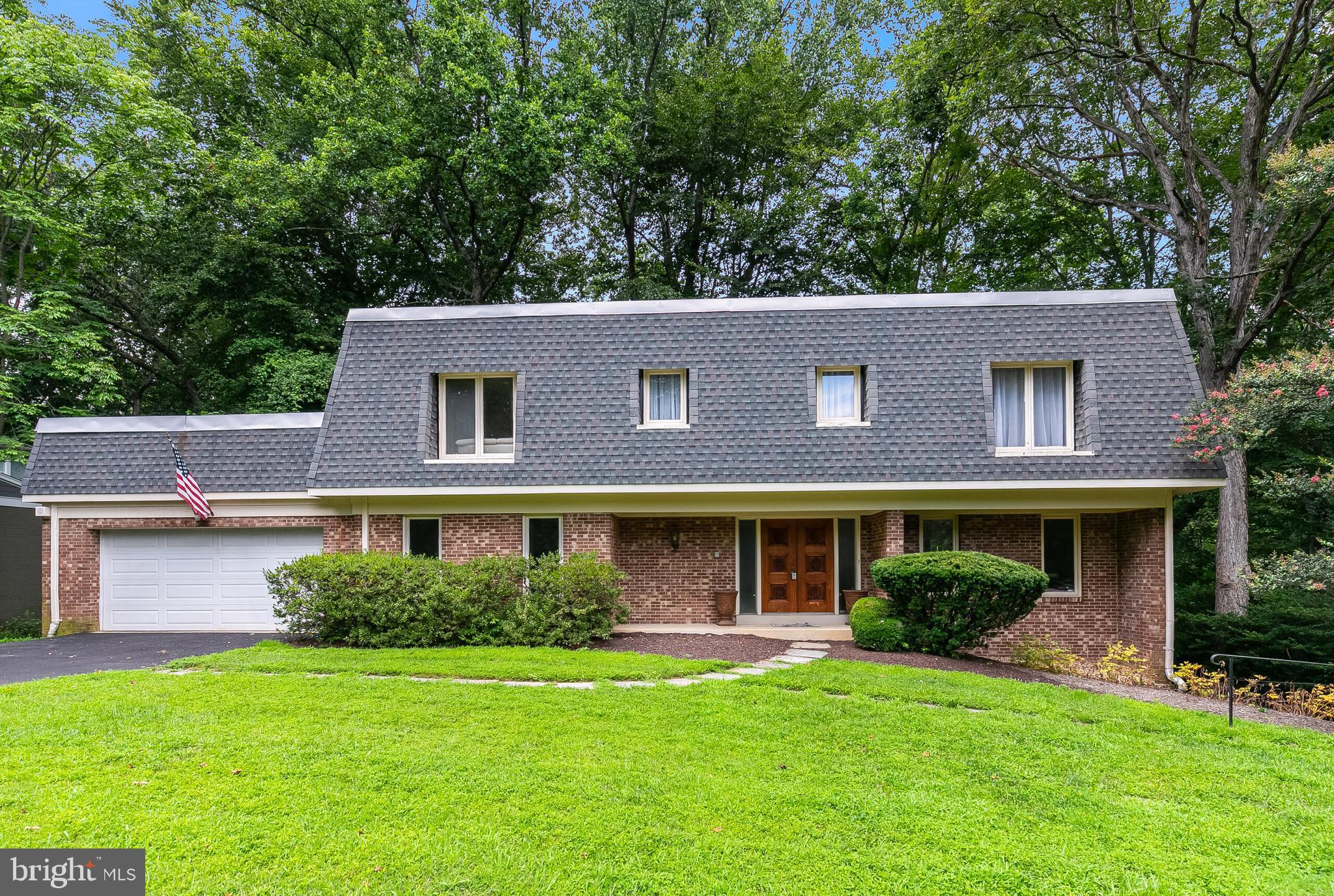 With over $200,000 in upgrades in the past two years, this beautifully updated 6-bedroom,  modern colonial home is conveniently located in McLean’s coveted Chain Bridge Forest—just one stoplight from D.C.  Blending sophistication with privacy, this home backs to 10 acres of protected woodlands—offering a peaceful retreat with unmatched access to the city.
Thoughtful renovations are evident throughout, beginning with the gracious foyer that opens to elegant formal spaces, including a living room with a classic brick wood-burning fireplace and a dining room framed by peaceful wooded views. The renovated kitchen features white-glazed cabinetry, stainless steel appliances, and new quartz countertops, seamlessly connecting to a sunlit breakfast room with access to the rear deck. A charming main-level bedroom/office with custom built-ins—and an adjacent powder room—adds even more versatility and functionality.
The upper level features a skylight that brightens the hardwood floors and leads to the spacious primary suite, complete with a sitting room, a Juliet balcony, a walk-in closet, and a spa-inspired bath which was renovated in 2024. Two additional bedrooms share a stylish hall bath.  Restoring a fourth bedroom on the upper level is possible.   The walk-out lower level includes a generous recreation room with patio access and flexible living space ideal for an in-law or au pair suite, featuring a kitchenette, two versatile bedrooms, and a full bath.
Notable updates include a new roof, a HVAC system, a fully renovated kitchen, a remodeled primary bath, a new driveway, and a new water heater—just to name a few.  This rare opportunity beautifully blends timeless elegance with modern enhancements and is ideally located near DC, most commuter routes, parks, and premier shopping,