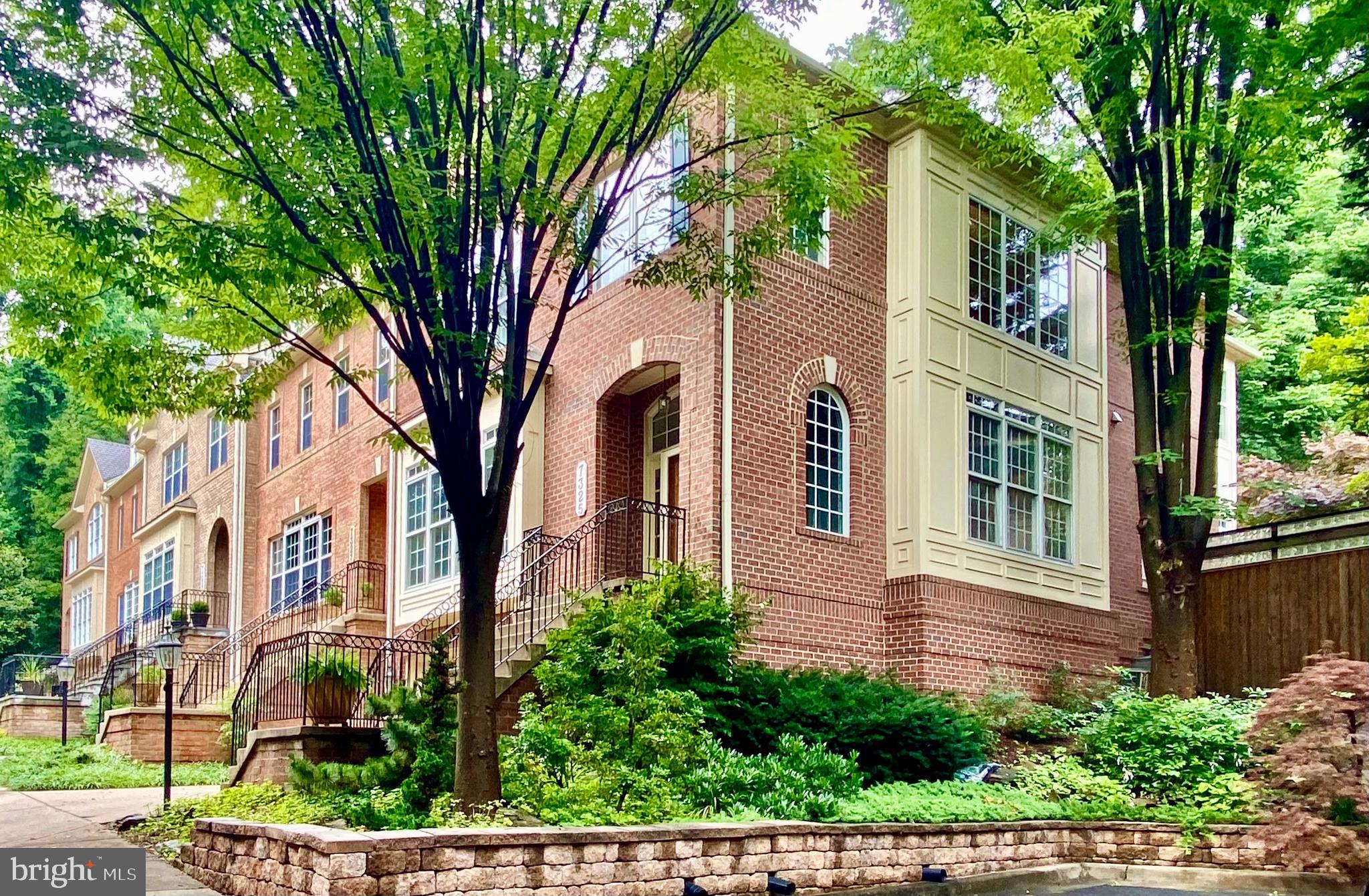 The three magic words of real estate are location, location, location and this magnificent brick beauty has it in spades! Truly a rare find, a home in this scenic enclave becomes available once in a blue moon and seldom do you see an end unit available. Quality built with only the finest materials, the property features 3 finished levels, a three level extension, soaring ten foot ceilings on the first floor and walls of glass towards the rear of the home with leafy views of nature from almost every vantage point. A large family room is open to the fabulous kitchen, which is vast, and a beautiful breakfast room overlooks the private serene rear garden.  The owner's sanctuary is so inviting you will never want to leave! This divine space includes a sitting room, a large walk-in closet, a whirlpool tub with a separate shower and gorgeous tile. The private and Zen-inspired rear walled garden backs to a conservation area and a deck and patio with a koi pond are perfect for dining alfresco. You can hear a pin drop in the ultra quiet Zen-garden. A short walk to Whitman, Pyle, parks and Kenwood for lovely morning and evening walks, are just added benefits of the superb location. A commuter, gardener and entertainers delight... this home is truly a gem!