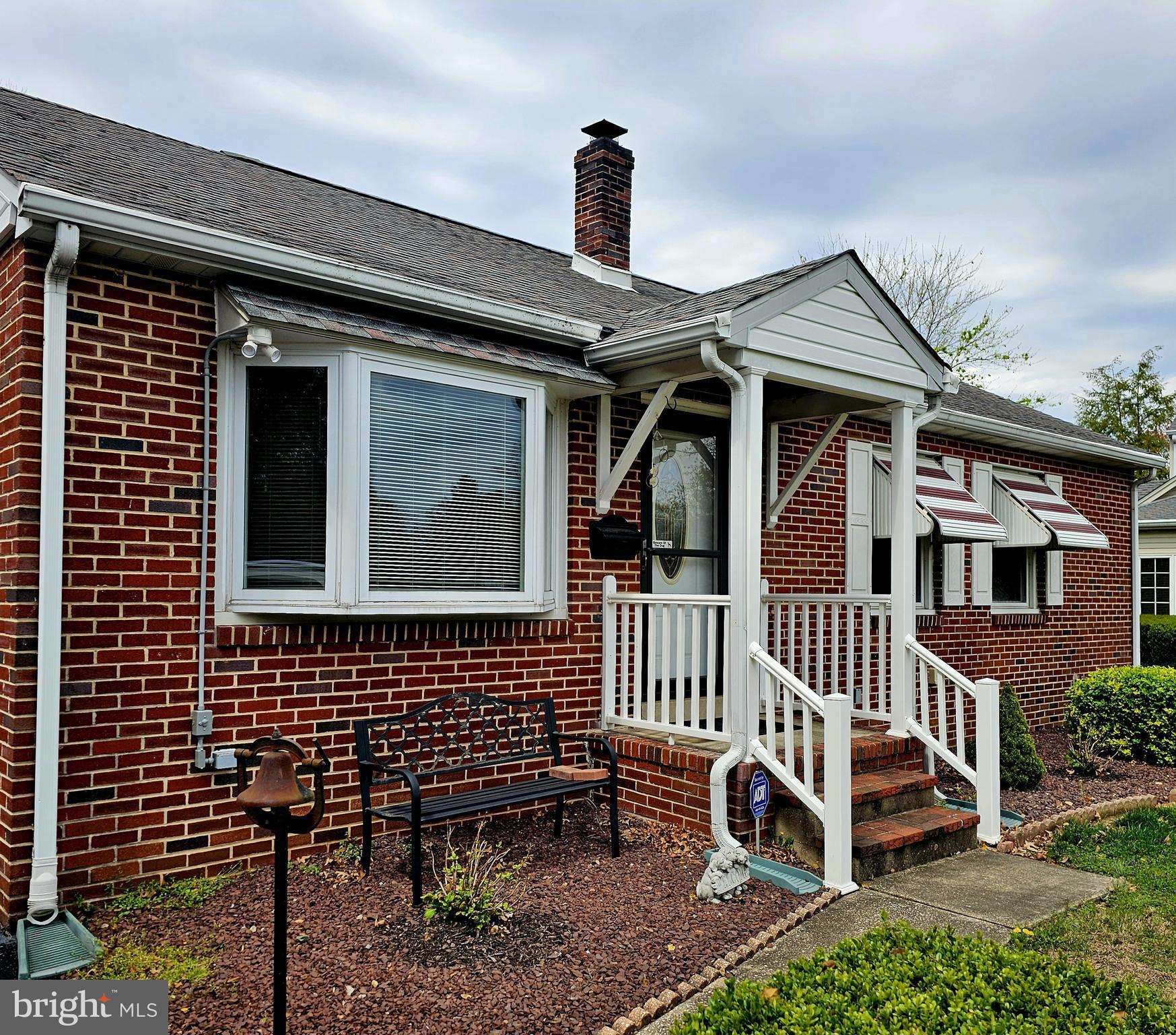 Welcome Home to this adorable Rambler/Ranch located in the original historical subdivision locally known as "The Heights".  This 3 bedroom 2 full bath ALL brick home has been lovingly maintained by its owners for the last 30 years.  The .409/acreage is a combination of lot numbers 2 & 3.  A beautiful sunroom and extended rear porch has been added over the years.   A huge 26' x 23' garage can easily accomodate 2 vehicles PLUS an additional 19' x 9' storage unit across the back of the garage for all your lawn equipment.  The basement is partially finished with a french drain and sump pump installed where the laundry facilities can easily be returned to open up the Sunroom on the main floor.  The other half of the basement is currently used for storage.  The property has been wired for a generator if you ever happen to lose power due to heavy storms.  They just don't build houses like this anymore.  The main floor is all hardwood flooring, with some currently under vinyl.   The location is conveniently located within town limits that includes public water, sewer and refuse but far enough out to enjoy neighborhood living.