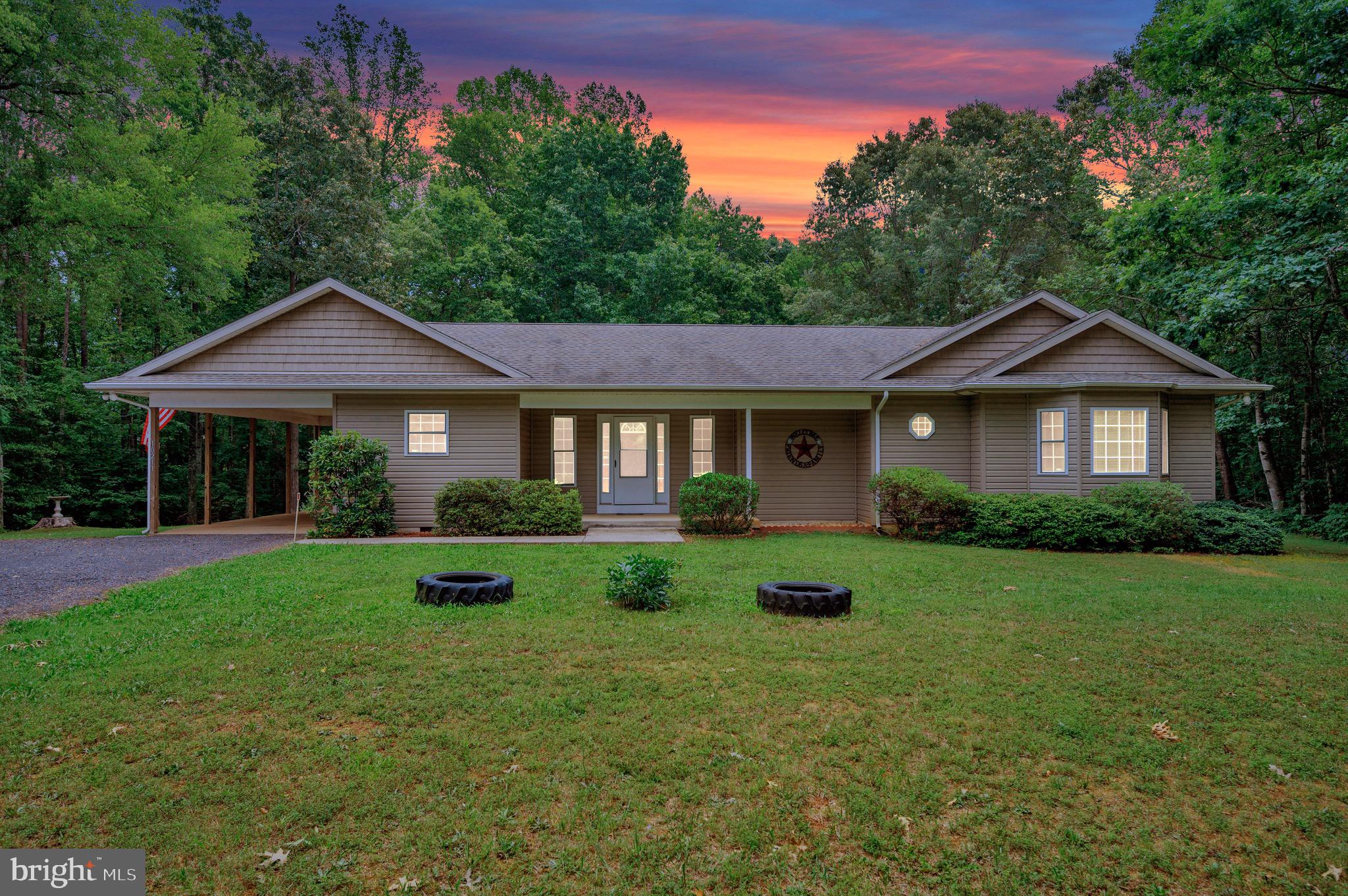 Welcome to 10211 Old Lawyers Rd set on just over three private acres in the heart of Orange County! From the moment you step inside, you'll notice the soaring ceilings, rich LVP flooring, and an airy living room centered around a warm gas fireplace. It's the perfect place to gather with family, celebrate special occasions, or simply relax at the end of the day.

The updated kitchen offers modern appliances, solid surface countertops, a pantry, and everything you need to prepare meals with ease. Just off the kitchen, the dining room provides flexible space that can also be used as a home office, playroom, or hobby area. Step outside to the screened porch, an ideal spot to enjoy your morning coffee, unwind in the evening, or watch nature all around you. The porch opens to an oversized deck designed for cookouts, entertaining, and making lasting memories.

The spacious primary suite offers a peaceful retreat with a private ensuite bathroom and a customized walk-in closet. Two additional comfortable bedrooms, a full guest bathroom, and a convenient laundry area complete the thoughtfully designed layout.

Outside, the welcoming front porch invites you to slow down and enjoy the quiet surroundings. The large backyard features horseshoe pits, plenty of room to play, and a wooded backdrop that provides privacy and a sense of escape. An oversized detached two-car garage offers excellent space for vehicles, hobbies, or a workshop, while the separate shed gives you even more storage for tools and outdoor equipment.

Located just a short drive from Fredericksburg, Culpeper, and Charlottesville, you'll enjoy convenient access to shopping, dining, wineries, and historic attractions while coming home to the peace and beauty of country living. Schedule your private tour today and discover everything this special property has to offer.