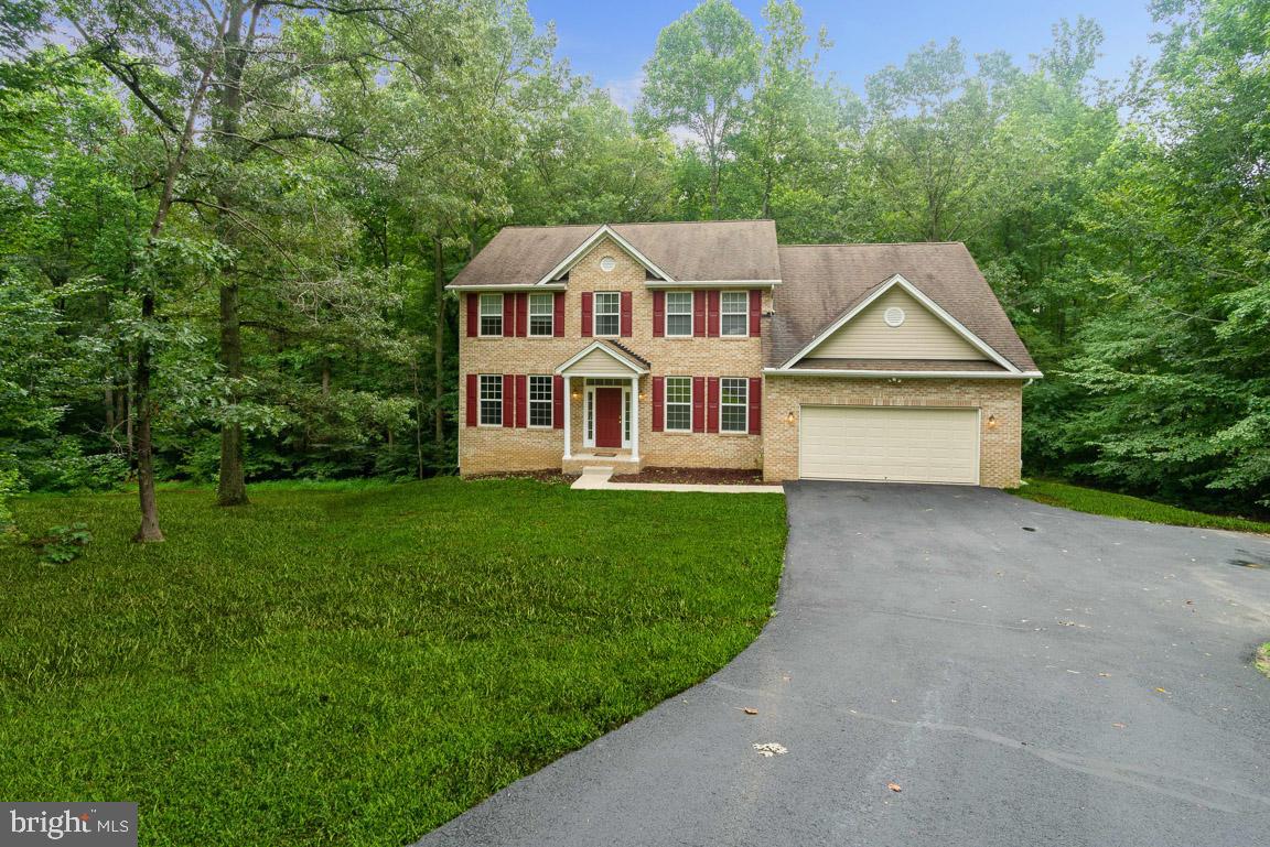 BACK ON THE MARKET. BUYER COULD NOT PERFORM. THEIR LOSS, YOUR GAIN!! 5000 sq ft &  2.34 acres of an eloquent private oasis! Slip away today to the serene suburbs of sought after Eastern Hills! Enjoy the peaceful ambiance of Hughesvilles' best kept secret! New Carpet On Upper Level! New wood floors on middle and lower levels! New Interior/Exterior Paint! New Driveway!!! Newer Deck!!Experience the classic contemporary colonial-style estate as you tour the long hallways with bold high-ceilings. Each room boasts of endless square footage, large picturesque views and cathedral architecture in all the right places. Whether relaxing on the three-level deck and listening to the beautiful sounds of nature; hosting a movie night in your fully equipped media room or having a cup of coffee on your front porch, this spacious hide-away will not disappoint!