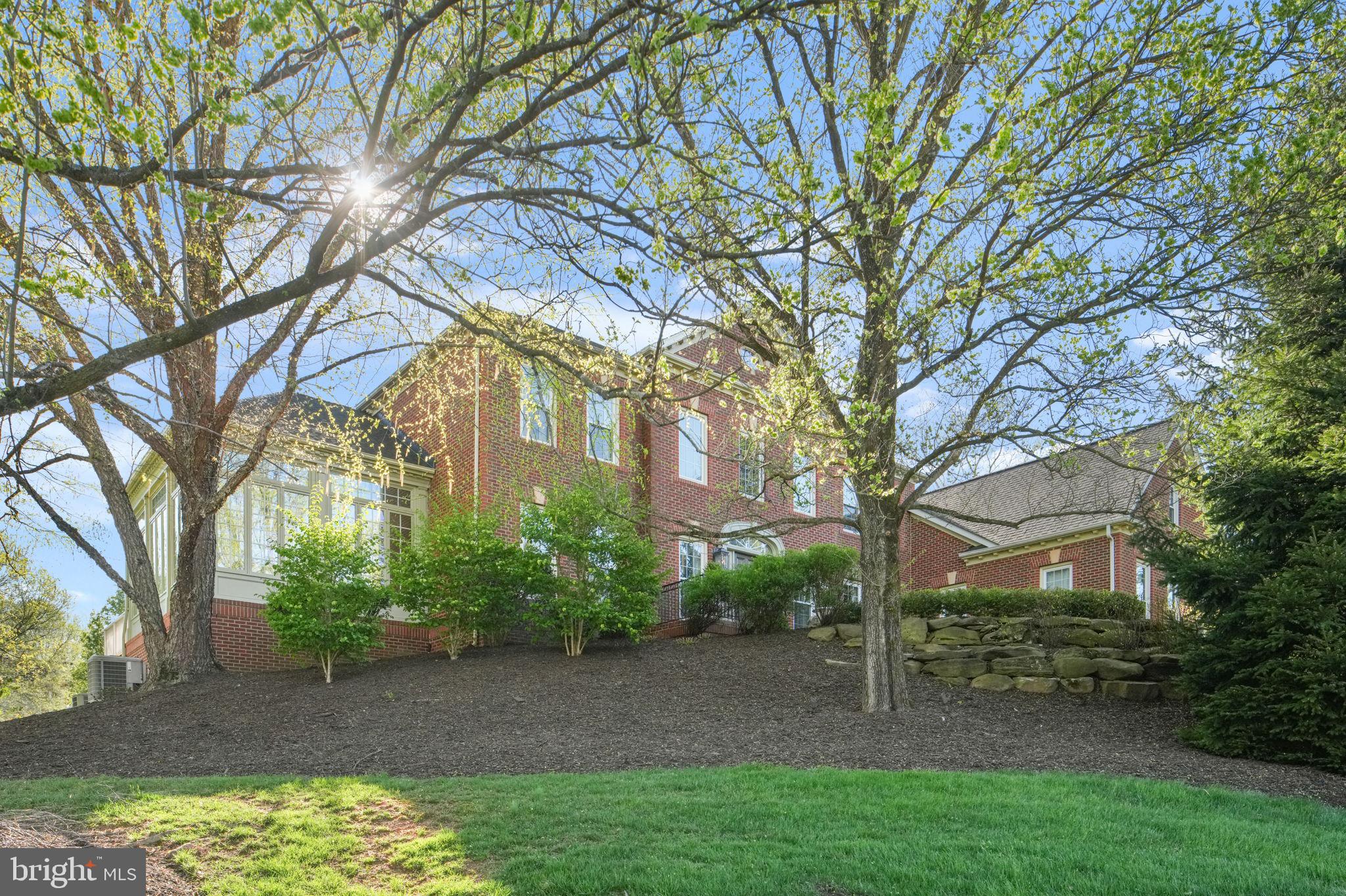 5 BR, 5.5 BA, traditional Colonial. Flagstone and brick walkway to the brick porch and front door. while natural light.  Kitchen-Quartz counters and island, Sub-Zero refrigeration and a Wolf six-burner range with griddle and double oven. Dining room with crystal chandelier, recessed lighting, large table space.  Walk-in Panty. Casual culinary lounge and  morning room. Private back staircase.  French doors to multiple decks .  Laundry room with utility sink.   Hardwood floors throughout main level (except mudroom and laundry room),including  living room, sunroom, office, and family room with 2 story coffered ceilings. Each of the five bedrooms offers a private, fully renovated full bathroom. Walk-in closets. Four bedrooms feature hardwood floors.The primary suite with  sitting room and dressing room .Primary bath featuring heated floors, motorized blinds, lighted mirrors, soaking tub, and an oversized walk-in shower. Custom closet with builtin cabinetry, jewelry storage, integrated lighting, and tailored wardrobe systems. The lower level-Pool table, ping pong, a golf putting green and fitness rooms. Full size bar -wine storage room. Entertaining made easy. A hidden panel storage room, additional bedroom and full bath. Large storage room. Walkout abasement to stone patio and paver fire pit. Roof 2024, HVAC 2026, Major renovation 2023, New asphalt driveway 4/2026. Electric car charger(s).