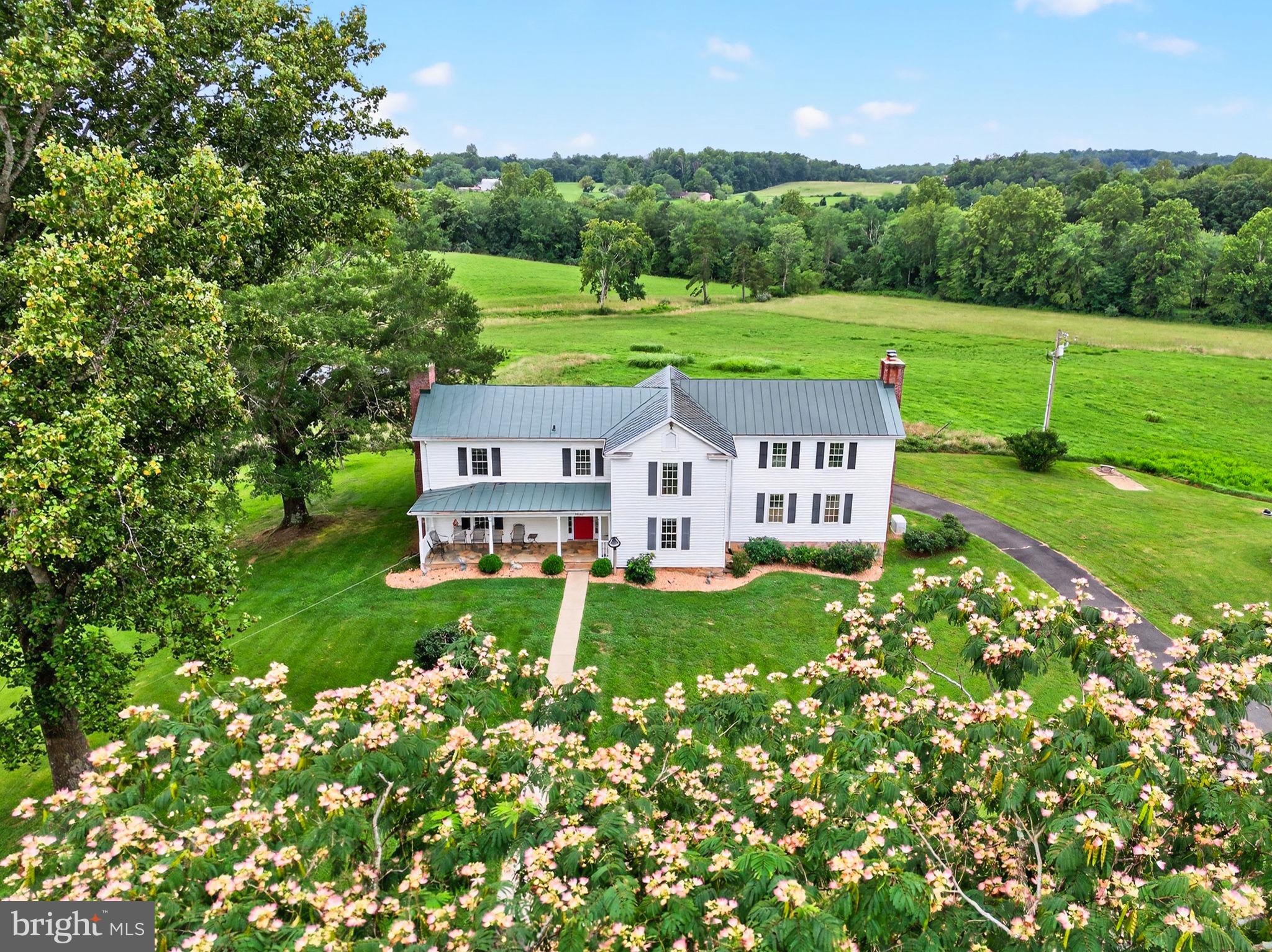 Happy Hill is an enchanting family farm that elegantly blends the past with the comforts of modern living. Set on over 57 picturesque acres the meticulously maintained 1880 Farmhouse evokes a storybook ambiance—rolling fields, tranquil pond views, and the enduring beauty of the Virginia countryside. With four spacious bedrooms—each thoughtfully designed with its own private bath—there is ample room to enjoy both privacy and comfort. The home’s gourmet kitchen seamlessly opens to a sunlit family room which was added in 2013. A luxurious master suite is conveniently located on the main level with views of the pond and fields The living room and family room both have fireplaces, and the large dining room can handle all your entertaining needs. A partial conditioned but unfinished basement is under the family room.  A charming one-bedroom guest cottage, complete with its own kitchen, living room, and full bathroom, is perfectly suited to hosting friends and family.  The six-stall barn boasts a spacious tack room, washer and dryer, and bathroom facilities. A large machine workroom is also part of the barn, offering abundant space for hobbies, repairs, or creative pursuits. Situated just 20 minutes from Warrenton and only 10 minutes from the quaint town of Washington, Virginia and outside of the Washington metropolitan area the property offers access to local amenities while providing a rural retreat. Perfect for a primary residence or a weekend home.
