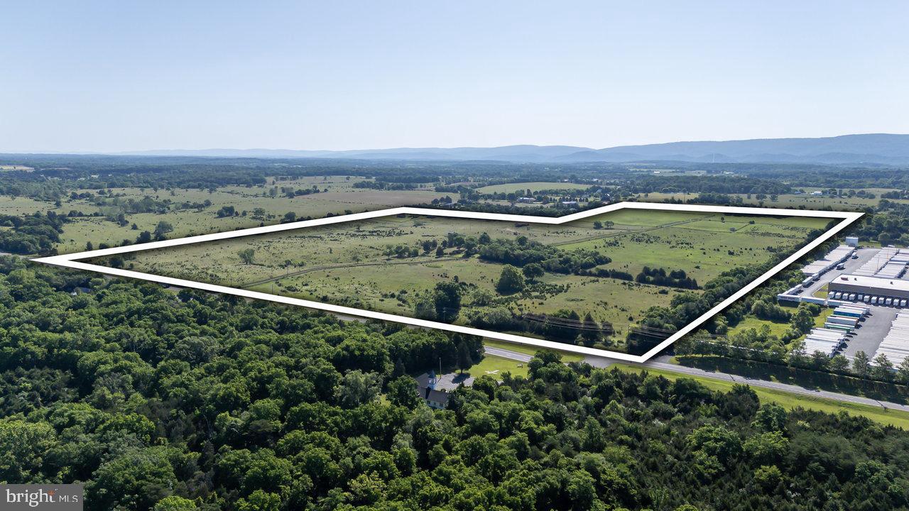 122 ACRES OF PRIME PROPERTY! This property is in a prime location in a heavy traffic area,  a large amount of road frontage on US Route 340 and also on Ashby Station Road which has a highway cross over on US Route 340 and near I66 and I81.  This property joins  Family Dollar Distribution Center property. Is currently zoned Agricultural but its highest and best use would be Commercial because of its location.  There are 2 residences, 2 drilled wells, a large building and barns currently situated on the property and it is fenced and cross fenced. A Wetlands Study has been done and is available upon request.  NO SHOWINGS WITHOUT AN APPOINTMENT! This property was originally 140 acres but there is currently an option to purchase 18 acres of the property where it adjoins the Family Dollar Distribution Center.