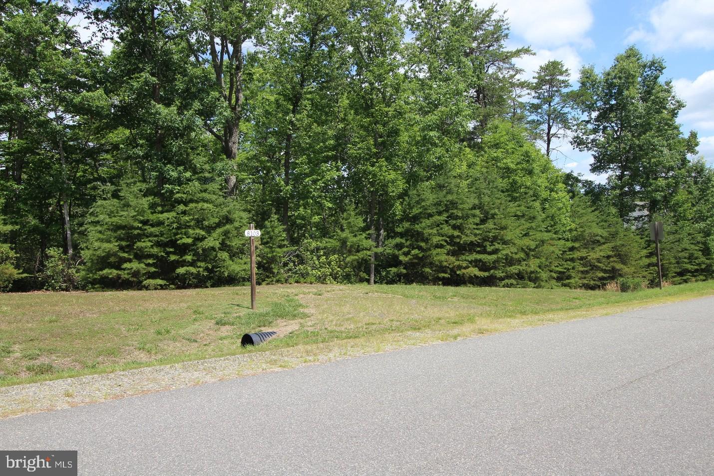 RIDGE‑TOP ESTATE HOMESITE IN THE ESTATES OF CHANCELLORSVILLE  
Located in one of Spotsylvania County’s most sought‑after estate communities, this exceptional 2.16‑acre wooded homesite offers privacy, elevation, and sweeping long‑range woodland views. The property rises to a prominent ridge overlooking a protected stream valley, creating an ideal setting for a custom residence with expansive decks, covered porches, and excellent walkout‑basement potential.

A mature hardwood forest surrounds the site, providing a peaceful, park‑like environment with abundant wildlife and year‑round natural beauty. The homesite includes an approved 4‑bedroom drip septic system; well installation required.

Ideally positioned near Chancellorsville Battlefield Park, the property offers convenient access to Fredericksburg, I‑95, VRE commuter rail, shopping, dining, and regional medical facilities. Low HOA dues contribute to the community’s appeal.

This is a rare opportunity to build a custom home that captures the feeling of a private mountain retreat while remaining close to modern amenities and daily conveniences.