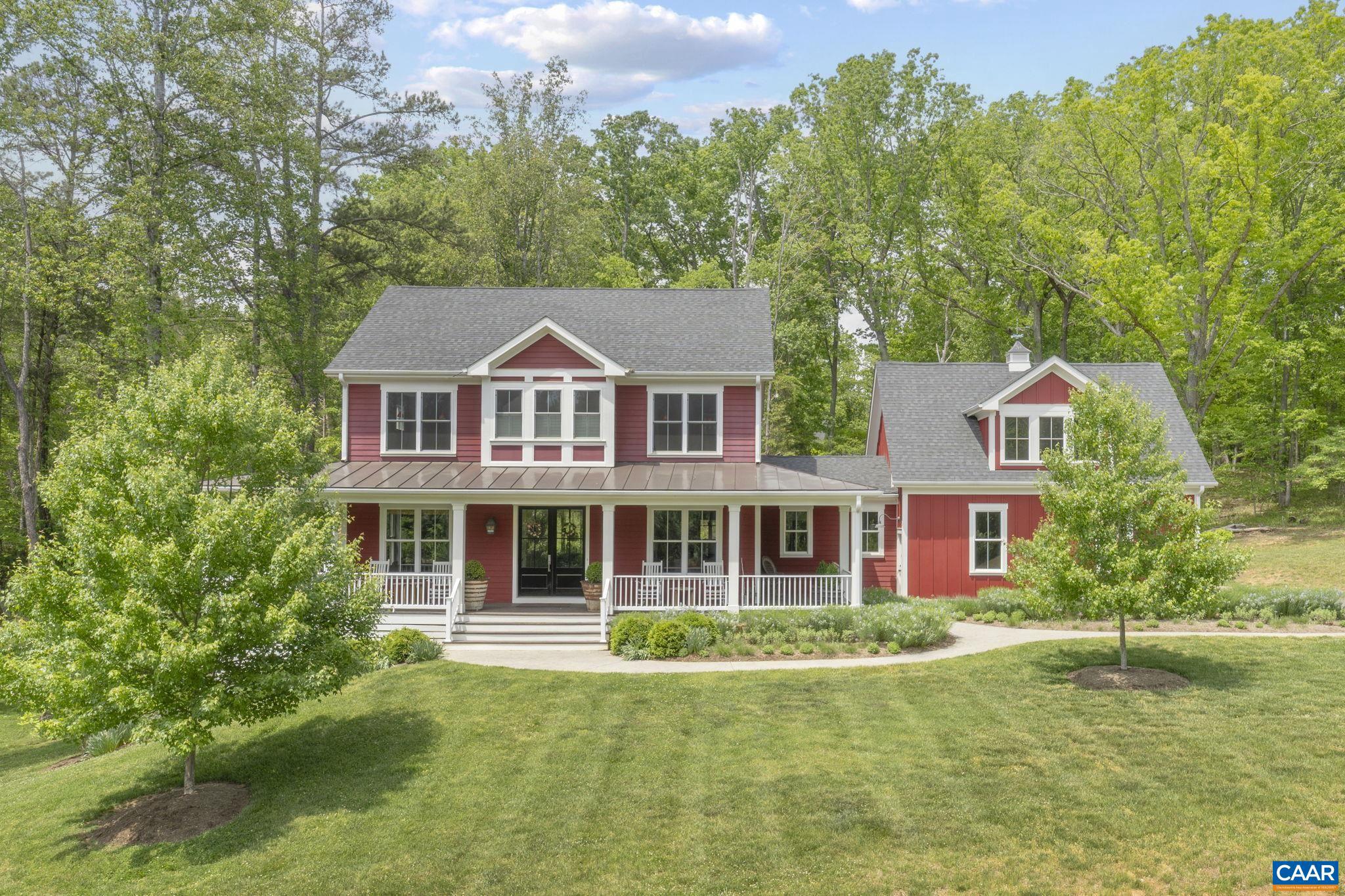 On 2.2 acres in a coveted neighborhood in Ivy, this 2016 home impresses at every turn with myriad wow factors from room to room. It features premium finishes, nine-foot ceilings on all three levels, and a thoughtful floor plan that blends comfort and style. The heart of the home is a striking kitchen, with a Calcutta marble island and built-in refrigerator, that opens to a great room with built-ins, large windows, and a wood-burning fireplace. Classic dining and living rooms flank the standout entry, while a playroom, mud room, and wet bar complete the main floor. Upstairs, there is a showstopping primary suite that includes a sitting area, gas fireplace, ensuite bathroom, and spacious walk-in closet. There are two additional bedrooms of good size that share a tasteful Jack and Jill bathroom. The walkout terrace level includes a handsome rec room, the fourth bedroom that doubles as a perfect guest suite, and immense storage. There is a fifth bedroom above the garage that is currently used as an office. In turnkey condition, every room of this house is a showpiece. Enjoy impressive outdoor spaces, too, including a large front porch, covered back deck, and fire pit, plus an outdoor shower and tons of room to spread out and explore.,Granite Counter,Marble Counter,Painted Cabinets,Wood Cabinets,Fireplace in Basement,Fireplace in Family Room,Fireplace in Master Bedroom