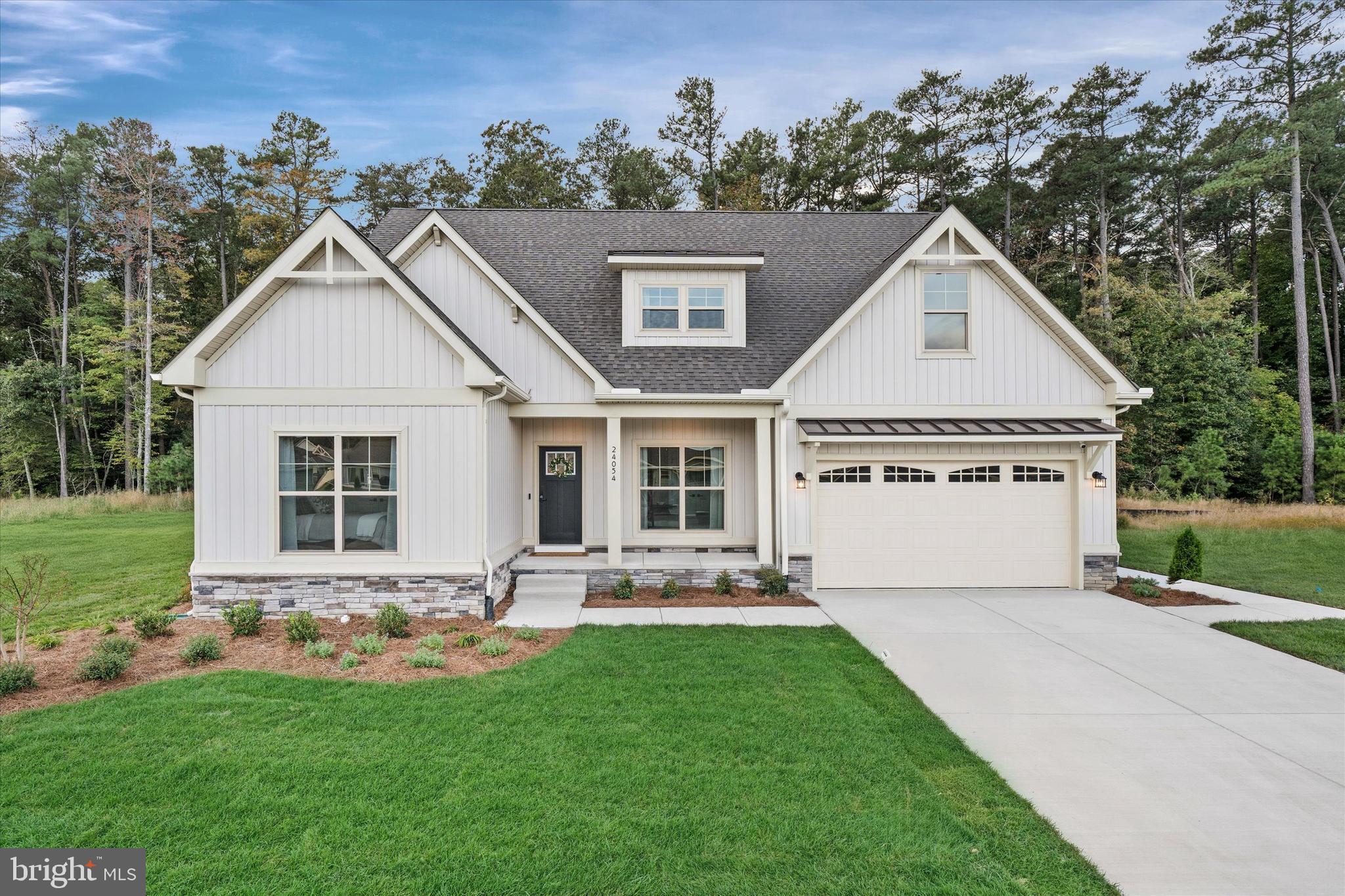 Built by award-winning local builder, Capstone Homes, this Torbay MODEL home on lot 82 in The Vines at Sandhill is available for purchase, plus Capstone may cover the impact fees and half the transfer tax*! This Torbay has a revamped floor plan and exterior elevation and comes fully furnished! Featuring 2,246 heated square feet, this model boasts a spacious primary suite with luxury bathroom, open kitchen, dining and living area, and cozy covered front porch. Capstone Homes goes a step above the competition by offering standard what some call upgrades. This particular home has been enhanced even more with stained beams in a vaulted ceiling and a floating mantel that add warmth and character to the space. The upgraded gourmet kitchen boasts sleek maple almond cabinets, quartz countertops, and a matching backsplash, creating a modern yet timeless appeal. The upgraded laminate floors throughout provide a stylish and durable foundation, while the finished bonus room and upstairs bathroom offer extra living space or room for guests. The spa-like primary bathroom includes a fully tiled shower with frameless glass shower door and gold plumbing fixtures and accents throughout. Enjoy the outdoors on your screened porch or the beautifully crafted paver patio on those warm summer nights. The Vines of Sandhill is an active, all-inclusive community offering state of the art amenities including full landscaping, irrigation, luxury pool, clubhouse, and more - all included with a modest HOA contribution. With local shopping and dining just minutes away, this community is one of the most desired in the area. Founded in 2006, this family-owned and operated local builder is committed to building quality homes throughout Sussex County. Call today to request a full list of Capstone's standard features, upgrades and floor plan or visit this Torbay Model at The Vines of Sandhill Mon-Sat 10am-5pm. Capstone Homes - Guiding you home, every step of the way. 
NOTE: This property is available now with a standard settlement, but will require a leaseback period. Please consult with the sale representative at the community. *Incentives and pricing may change at any time. Transfer tax and impact fee coverage when paying cash or using the preferred lender.