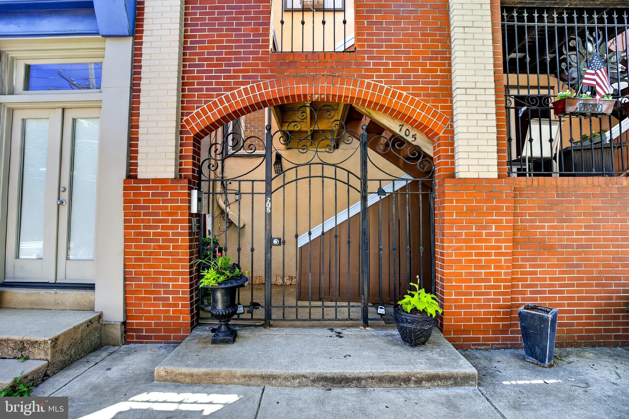 Welcome to 705 S. 20th St, unit D.   This is a rare opportunity to own a fully updated Graduate Hospital location with garage parking and an amazingvate rooftop deck.   Unit D is a bright  2 bedroom.  2 bath condo, 1200 square feet, boasting a newly installed kitchen, new stainles steel applicances (stove and Microwave),  updated bathrooms, new flooring in bedrooms, and freshly painted throughout.   This home is move in ready.  .  Enter through the secure front gate  to this 2 level condo.    The first level has a bedroom with a walk-in closet and updated ensuite bath.  Up to the second level you wil find a spacious open floor plan.  The great room boasts a vaulted celing, hardwood floors and a log burning fireplace. The great room is bright,  with  sunlight streaming through  the large window  at the top of the vaulted celing.  The kitchen is newly installed with stainles steel appliances, breakfast bar, stone counters, tile backsplash and a stackable washer dryer.  Down the hall is a updated hall bath, second bedroom and stairs to the incredible roof top deck.  The roof top deck provides an inviting  leisure and entertaining space overlooking the Philadelphia skyline.  This location can't be beat, only 5 blocks to Rittenhouse square.  The Septa bus stops  in front of the building and numerous restaurants, drug store,  banks, hospitals, and pubs are all within a short walk.  This unit is pet friendly, and has one secure underground parking space.  The condo fee includes water, sewer,  exsterior maintenance, trash, and parking,  withan   amazing low of $193.00 per month which is payable quarterly.   You can have it all with this home, low fees, parking, roof top deck, working FP unbeatable location, ultimate convenince. and a move-in ready home.  Easy to show,  and available immediately.