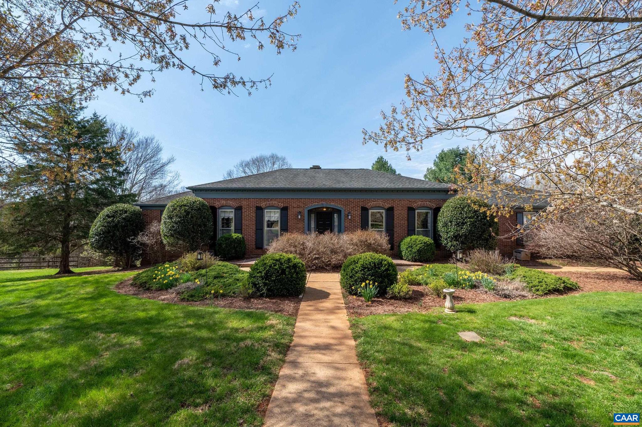 Beautifully maintained brick ranch on 2+ acres with mature landscaping, located on a quiet cul-de-sac. Built by Ollie Fitzgerald, this home offers main-level living with three bedrooms, two full baths, and a comfortable family room. The walk-out basement expands your living space with a large rec room, third full bath, and versatile bonus room. Enjoy outdoor living with a screened-in porch, spacious deck, and ground-level patio overlooking the private yard. Additional features include a 2-car garage, 14kW Generac generator and invisible fence with two collars. Small, walkable, private neighborhood, yet convenient to Chris Greene Lake, Ivy Creek Natural Area, Rivanna River, Holllymead and Stonefield shopping areas. Perfect for those seeking main-level living with space for entertaining, and play?schedule your showing today!,Wood Cabinets,Fireplace in Basement,Fireplace in Family Room