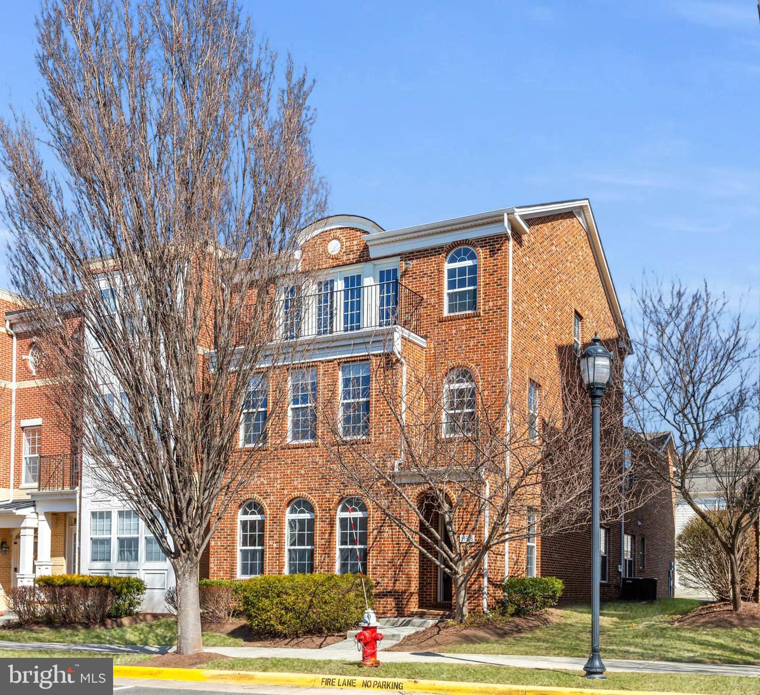 Move right into your gorgeous newly updated END-Unit townhome with upgrades incl. NEW flooring (2025) on the main level, NEW hardwood floors (2025) on the upper level, NEW stainless steel cooktop (2025), NEW stainless steel double oven (2025), NEW stainless steel microwave (2025), NEW granite vanity tops (2025) in bath, NEW faucets (2025) in bath, NEW mirrors (2025) in primary bath, 1 year old commercial grade water heater, and more! Experience luxury, convenience, & space in this gem with an expansive 3,373 sq ft of living space in sought-after Lansdowne Town Center. With beautiful curb appeal, elegant brick is stunningly featured on the entire front, the entire side of the house, & the covered entry. Retreat to TWO outdoor spaces, a private courtyard patio outdoor oasis & a balcony with amazing views. Convenient to the clubhouse, pool, local shops, restaurants, & recreation, this fabulous gem blends timeless elegance & modern design with 9' high ceilings on the main & 2nd level, dramatic vaulted extra-high ceilings that add airy grandeur on the 3rd level, an abundance of oversized windows for natural light, and an open floor plan. Entertain in your open floor plan with a fabulous flow as: Your spacious living room ideal for everyday living OPENS to -> your elegant formal dining room with elegant crown molding that FLOWS into -> your modern kitchen with granite counters, brand-NEW stainless steel cooktop, brand-NEW stainless steel double oven, brand-NEW stainless steel microwave, recessed lights that OPENS to -> your breakfast room or family room infused with natural light that OPENS to -> your private patio outdoor oasis, perfect for hosting a barbeque or enjoying a morning cup of coffee. Retreat upstairs to your light-infused loft, perfect for lounging or a home office. Relax in your oversized primary suite with custom shelving & drawers in 2 generous walk-in closets, a ceiling fan, & an ensuite bathroom with double vanities, separate walk-in shower, separate tub, and natural light pouring in via an array of three windows. The second bedroom is infused with natural light via two walls of windows & features soaring high vaulted ceilings, a ceiling fan, a walk-in closet, and another ensuite bathroom. The third bedroom is like your personal retreat, featuring dramatic extra-high vaulted ceilings, a walk-in closet with a full sized window, and access to your private balcony offering amazing views. The fourth bedroom also features extra-high vaulted ceilings, a walk-in closet, and an entrance to the jack-and-jill bathroom with double sinks. Ceiling fans are featured in all 4 bedrooms, the living room, & the breakfast room. All 4 expansive bedrooms have walk-in closets (the primary suite has 2 walk-in closets). Laundry is conveniently located on the bedroom level. Community amenities include: clubhouse, outdoor pool, gym, yoga studio, park, fitness center, dog park, playgrounds, walking and jogging paths. This property is convenient to the Town Center with Starbucks, Harris Teeter, CVS, and an array of restaurants, shops, etc. Near Route 7, the Golf Club at Lansdowne, Lansdowne Resort and Spa, hiking trails and Elizabeth Mills Riverfront Park. Do not miss this gem!