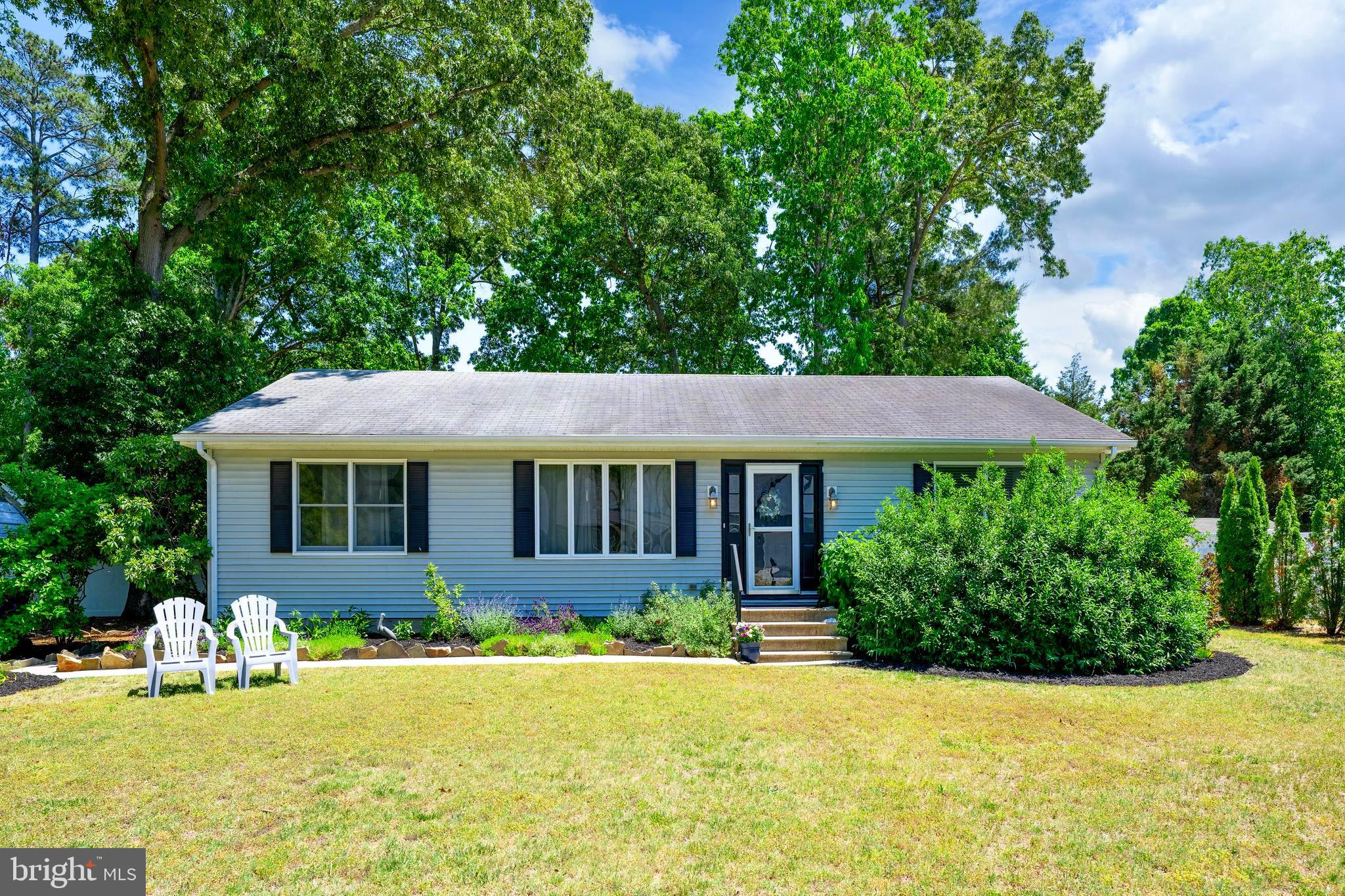 Nestled in the serene Deerwood community, this charming ranch-style home offers a perfect blend of comfort and functionality. With 1,741 square feet of thoughtfully designed living space, this residence features three spacious bedrooms and two full bathrooms, ensuring ample room for relaxation and privacy. The kitchen is equipped with essential appliances, including a dishwasher, refrigerator, and electric oven/range, making meal prep a breeze. Enjoy your morning coffee in the delightful breakfast area, where natural light pours in, creating a cheerful start to your day. The home boasts a well-appointed bathroom with a convenient stall shower, while the attic provides additional storage options. Beautiful flooring choices, including hardwood, tile, and plush carpet, enhance the home's appeal, offering both style and comfort. Outside, the expansive 0.34-acre lot features a lovely deck, perfect for entertaining or simply unwinding in the fresh air. A detached carport with lighting and asphalt driveway provide ample parking space, while a shed offers electric and extra storage for your outdoor essentials. This delightful property combines the charm of a well-established neighborhood with the comforts of home, making it an ideal choice for those seeking a peaceful retreat. Enjoy being centrally located being 15 minutes to beaches, 15 minutes to downtown Milton, and 15 minutes to Georgetown. Experience the warmth and potential of this inviting residence today!