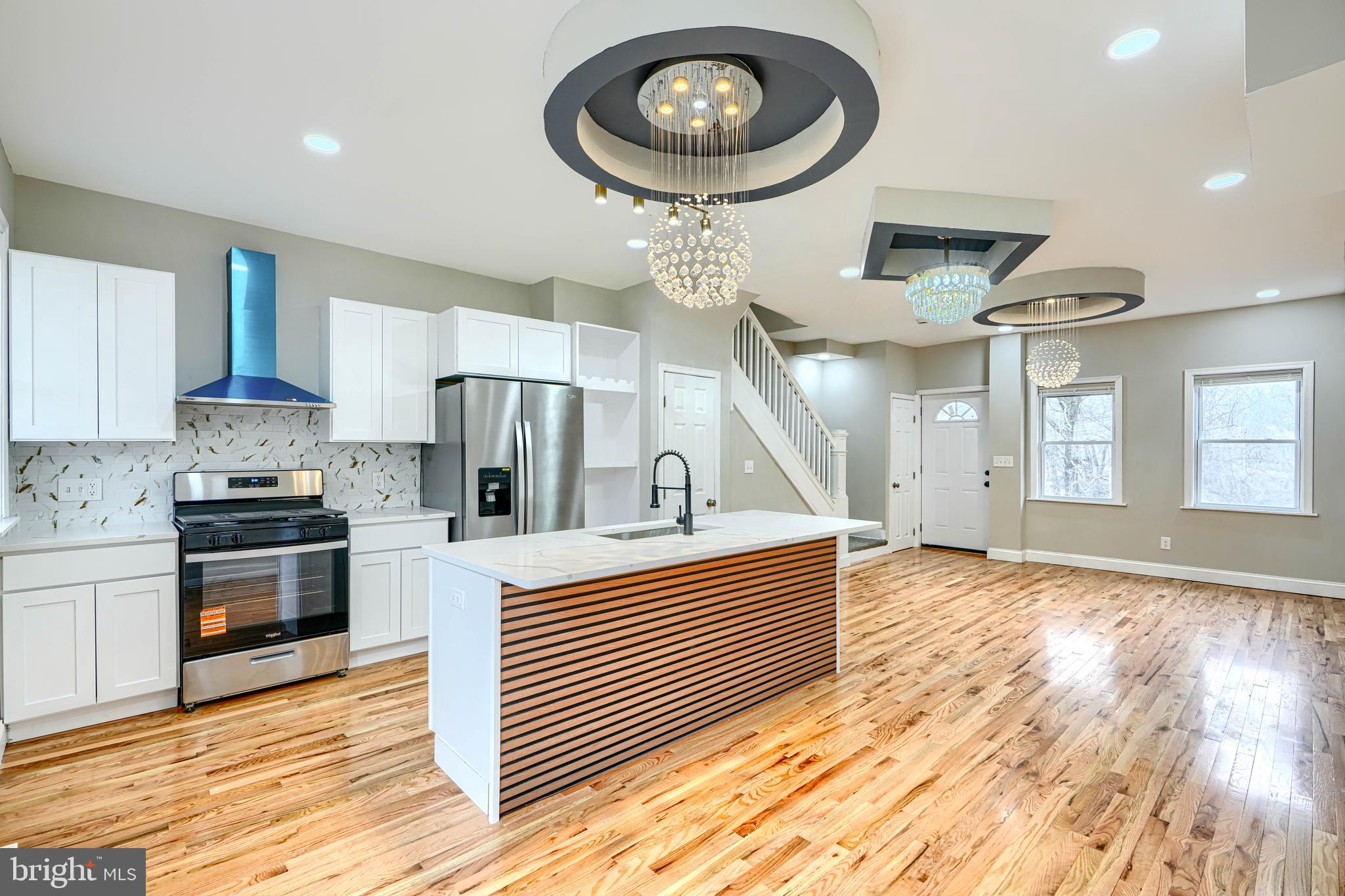 New price! Amazing renovated home with so many upgrades: Open layout, Beautiful designer light fixtures, Hardwood flooring, Gorgeous kitchen with Island, Calacatta Quartz countertop, coordinating backsplash, wood shaker cabinets, and stainless steel appliances. Upstairs bath is elegant and comfortable, with Floating Vanity and custom tilework. Fully finished basement can be used as a family room or 4th bedroom, full bathroom with another Floating Vanity, and laundry area. This home features coordinated lighting and plumbing fixtures, new doors interior and exterior, new replacement windows, recessed lighting, HVAC,  covered porch. You will love this home.