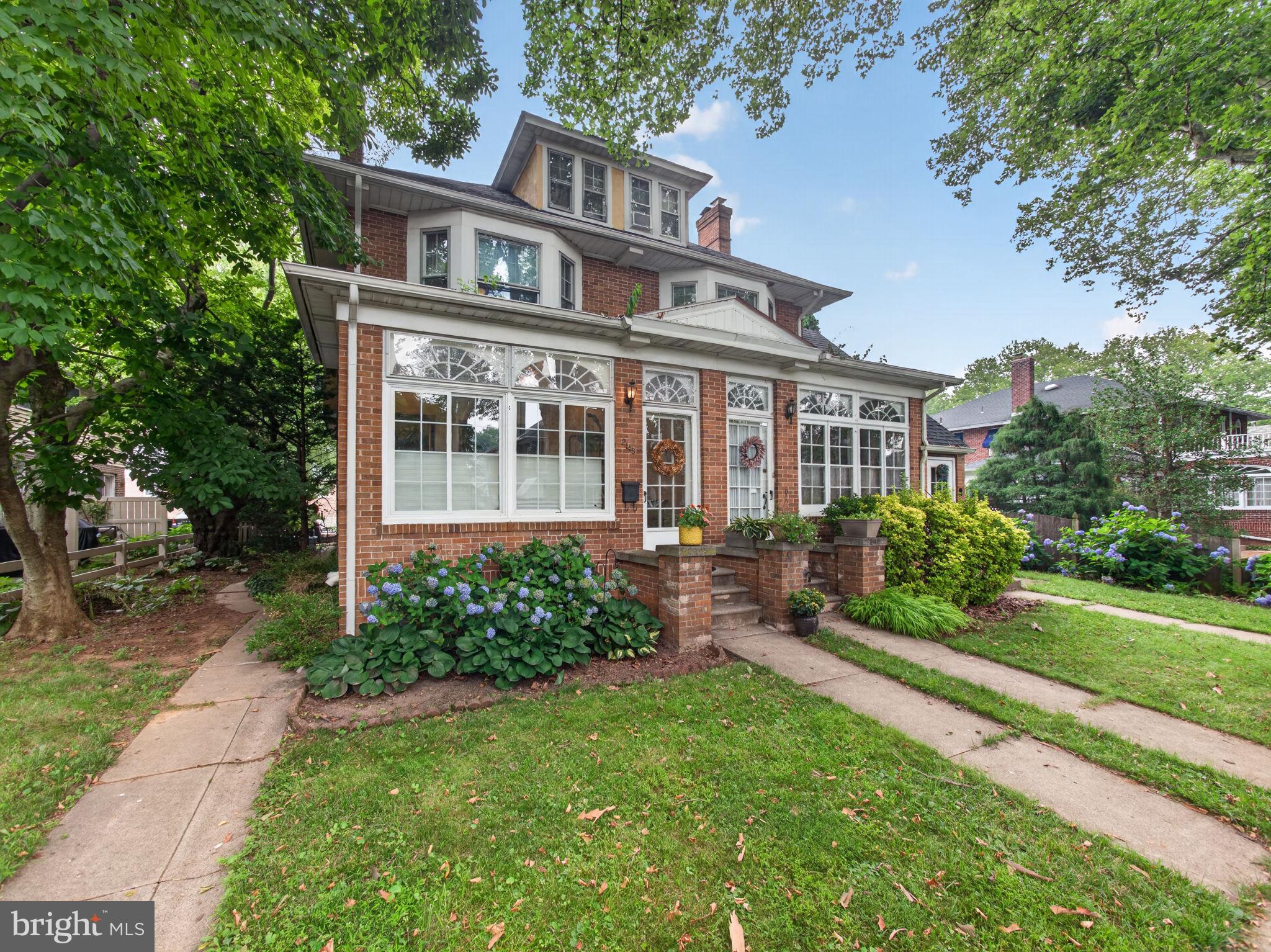 Must-see spacious College Heights/West End brick & stucco twin! Offering over 2,300 square feet of living space, this charming home features 4 bedrooms plus a bonus room on the third floor, providing plenty of flexibility for various uses. Relax in the inviting enclosed front porch/sunroom and enjoy the convenience of the rear mudroom located just off the kitchen. The spacious living room showcases beautiful hardwood floors and a cozy gas fireplace, while the formal dining room also features hardwood flooring—perfect for entertaining. The eat-in kitchen includes an electric range, built-in microwave, dishwasher, pantry, laminate flooring, and a built-in table with chairs that will remain with the home. Third floor offers even more space with an unfinished storage area and cedar closet. Additional highlights include a 7 year old main roof, many replacement windows throughout, great closet spaces, four window air conditioners, a brick patio with exterior lighting, and an 18' x 17' detached two-car garage. High-efficiency gas boiler for added peace of mind. The basement includes a washer, dryer, utility sink, working toilet, and an outside entrance with a full-service door. Updates also include a newer water heater. A 12-month home warranty is included.