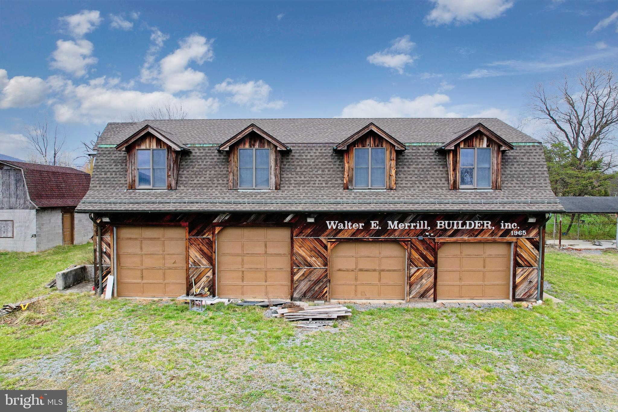 Unlock the potential with this impressive 2,160 sq. ft. commercial garage/shop offering space, function, and flexibility for a variety of business uses. This well-equipped property features four large garage doors for easy access, excellent workflow, and convenient vehicle or equipment storage. A compressor and woodstove convey with the sale, adding even more value and practicality for the next owner. The second floor offers office and storage space, making it ideal for administrative use, inventory, tools, or expanded workspace.  The possibilities here are truly unlimited—whether you are looking for a mechanic’s shop, contractor headquarters, storage facility, workshop, or investment opportunity. Water and sewer hookups are available, adding to the property's future potential and versatility. Outside, you will find a large parking lot with room for 14+ vehicles, providing ample space for employees, customers, equipment, or fleet parking. All of this is set against beautiful mountain views and a convenient location close to everyday amenities.   This is strictly a package deal and the parcels will not be  sold separately. A rare opportunity to secure multiple parcels with outstanding commercial potential—call today for more details.