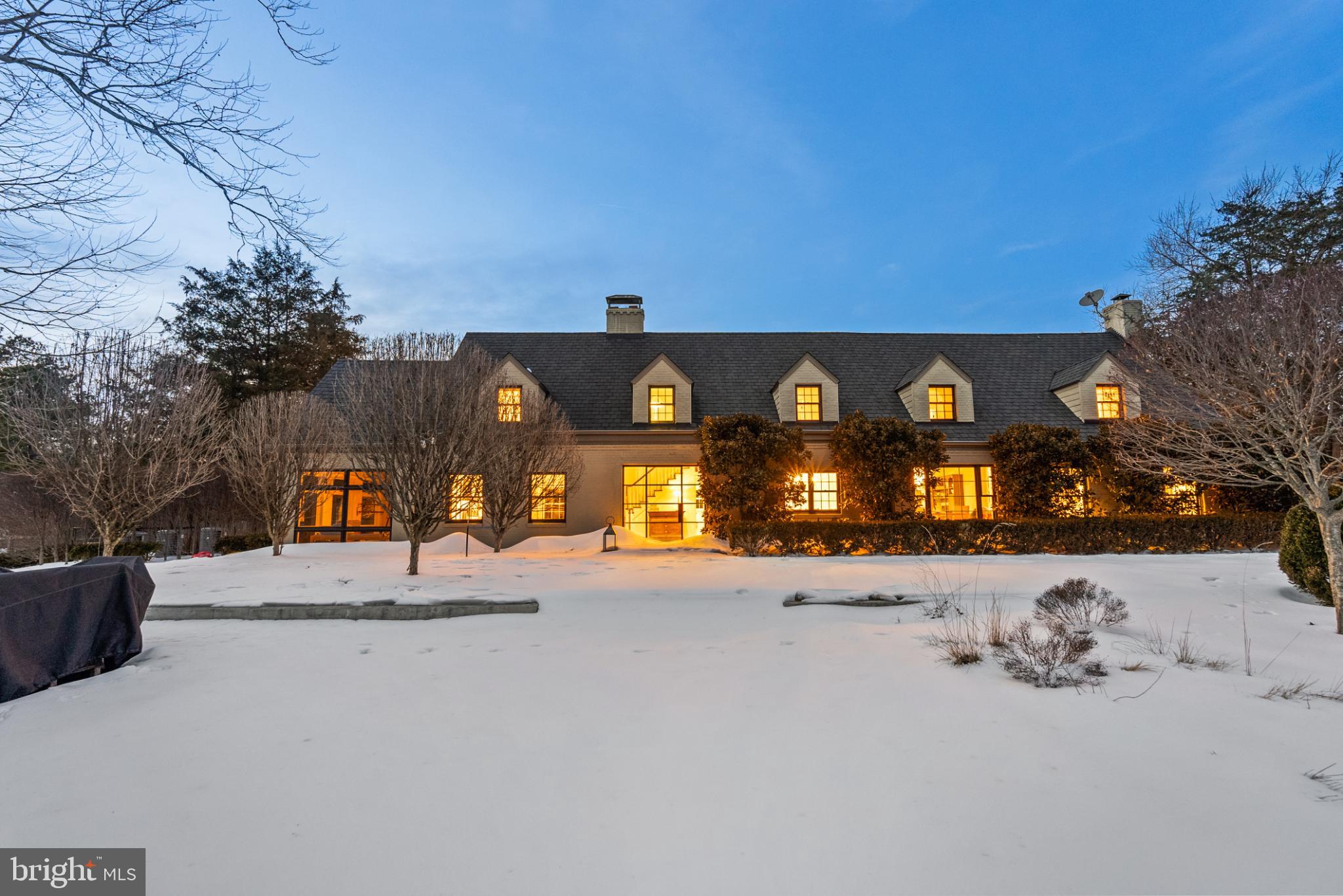 As featured in Home & Design Magazine, this gated residence sits on 3 private, fully-fenced acres, meticulously curated by Katia Goffin Gardens, and seamlessly merges farmhouse with contemporary - a true sanctuary only minutes from all the conveniences of Reston and major commuting arteries of NoVA. The expansion, lead by architect Stefan Schwarzkopf with Allied8, thoughtfully incorporated the original part of the home (The Vale Dairy Farmhouse, circa 1940), conveying a unique history and character with the property.

 ● The two-story foyer showcases floor-to-ceiling windows overlooking the heated saltwater pool, bluestone patio, ipe decking, and three fountains, bringing the outdoor living space into the home all four seasons. Accessible via the foyer mezzanine is one of the Primary Suites, showcasing hardwood floors (just refinished), two walk-in closets, a spacious en-suite bathroom, laundry closet, and built-in storage. The private balcony, accessible via the floor-to-ceiling window wall (with automated shades) overlooks the pool patio and rear of the property. This flexible suite has also functioned easily as additional living space or an office.

 ● The central foyer also leads to the original part of the home, including a beautiful, corner family room (expanded in 2021) with white oak floors & wood-burning fireplace and the eat-in kitchen, featuring a luxury appliance package, breakfast bar on the cooking island (4 chair seating), abundant cabinet and counter space, butler’s pantry, coffee bar, and a dining table nook overlooking the Boxwood Garden. The rear of the main level includes a powder room, office, large closet, spacious living room (with another wood-burning fireplace), a 210 SF sunroom overlooking the gardens, a large storage closet, and a staircase foyer to the upper level bedroom suites.

 ● Offering both flexibility and modern comfort in its bedroom layout, the additional 3 bedrooms (all of ample size) each feature an en-suite bathroom and copious closet space. NOTE: The current owners expanded the front bedroom, creating a large secondary Primary Suite. In addition to the utility room and an expanded kitchen/storage area, the walk-up basement also features a large hobby room or storage room with a substantial center island.

 ● The extensive $1M landscaping investment significantly elevates this pristine property, creating two beautiful gardens while leaving expansive, rolling hills with a bucolic view on the rear of the property. At this point, the trees and shrubbery are lush and mature after years of meticulous maintenance and attention and an underground drainage system has ultimately perfected the function of the Boxwood Garden.

 ● Additional features of this home include: 4-car garage + motor court for 6+ additional cars, wine room, custom Lutron lighting package (interior & exterior), heated flooring, outdoor kitchen, two manicured gardens, fully-fenced perimeter with two electric gates (incl. secondary “service” entrance), large storage shed, and plentiful natural light through modern windows throughout. 

 ● All systems have been carefully maintained and just serviced prior to listing, including the septic system (with two tanks), the well-water treatment system, the 37-zone irrigation system, two wood-burning fireplaces, the generator, and the saltwater pool. The current owners have recently replaced 3 of the 4 HVAC systems and installed a new hot water heater. **NOTE: the 6,244 Total Estimated SF does NOT include the  780 SF 4-car garage.

 ● This unique home, brimming with historic charm and contemporary character, is moments from all the conveniences of Reston and Northern Virginia, including Reston Metro only 3.5 miles away. The property backs to miles of connected trails (Difficult Run) and is under 15 minutes to Dulles Airport and central (< 10 mins) to Fair Oaks, Reston, and Oakton.