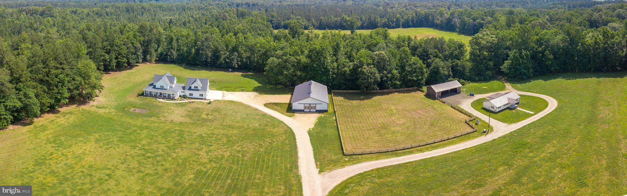 Wonderful opportunity here!!  Two homes, large 48x72 barn/garage, 4 stall horse barn plus over 159 acres of woods and fields for hunting, farming or seclusion. Main house built in 2017 with lots of special features. Master en-suite features custom blinds, walk in closet with custom built-ins, huge master bath with double sinks, large walk in shower, soaking tub, private water closet w/urinal and its own laundry area. Additional main level guest room w/full bath.  Two laundry areas, one in Master one in mudroom.  Custom kitchen with high end stainless steel appliances,  white solid wood cabinets by Millers Custom Cabinets,  and granite counters.  Mud room with second laundry area, custom built-ins and doggie bath. Engineered hardwood throughout entire home.  Upper level with two large bedrooms and full bath plus sitting area. French doors opening to upper deck overlooking large back yard. Lifetime metal roof, wonderful stamped concrete front porch and extra large screened porch on rear of home.  Two car garage is heated and air conditioned. One bedroom apartment over garage with full kitchen, private bath and full size laundry also.  Rental home on property has 2 bedrooms 2 full baths, back porch, new laminate  flooring and new metal roof.  Four stall horse barn, and fenced horse pasture.  48x72 barn built in August 2019  with plenty of room for camper, boat, all your farm  equipment or just your toys!!