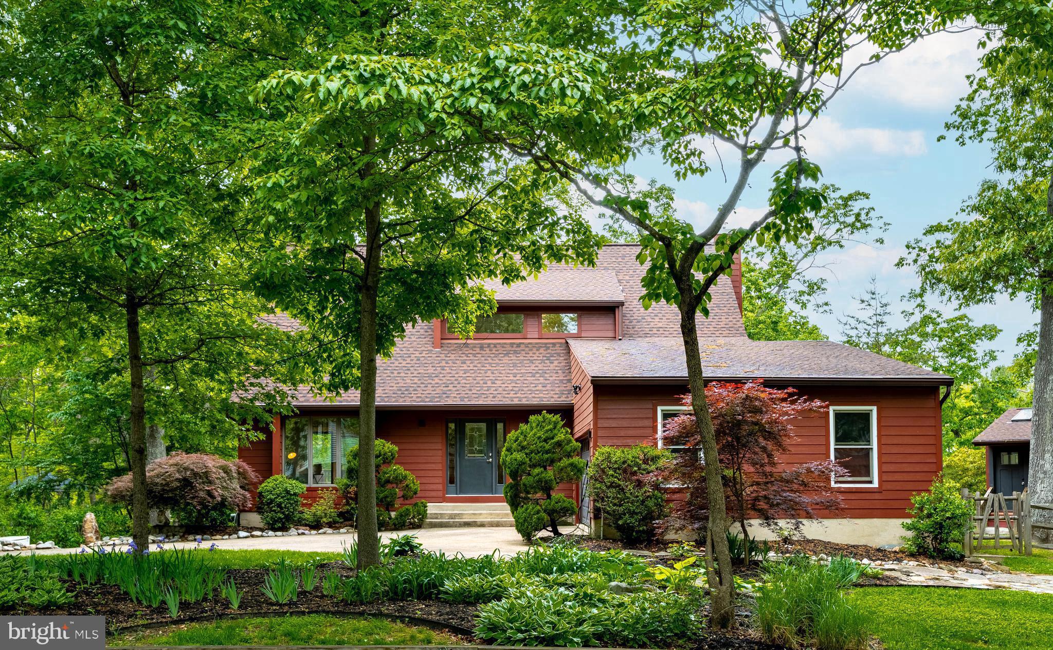 Tucked away on a quiet cul-de-sac in Anne Arundel Co, this exceptional waterfront retreat blends striking contemporary architecture with the warmth and comfort of everyday luxury. With 4 bedrooms, 3.5 baths, and panoramic water and woodland views, 771 Macsherry Drive offers a lifestyle that feels both private and inspiring.

Inside, rich hardwood floors and soaring walls of elegant windows create a light-filled atmosphere designed to bring the outdoors in. The thoughtfully designed floorplan showcases sweeping water views while offering comfortable spaces for entertaining flow and relaxing alike. The stunning primary suite is a true sanctuary, featuring oversized closets, private balcony access, and a renovated spa-inspired luxury bath with an expansive walk-in shower.

Outdoor living takes center stage with expansive decks, two private balconies, and a beautifully updated dock ready for boating, kayaking, or simply enjoying peaceful waterfront sunsets. A separate cottage with a brand-new hot tub creates the perfect getaway space.

Ideal for multigenerational living, the home also features a true in-law suite complete with its own private entrance, full kitchen, and separate laundry. Additional highlights include durable HardiPlank siding, a spacious two-car garage, and the peace of mind of a 17kW Generac whole-house backup generator.

This is a rare opportunity to own a sophisticated waterfront home that seamlessly combines architectural beauty, flexible living spaces, and resort-style amenities in one of the region’s most tranquil settings.