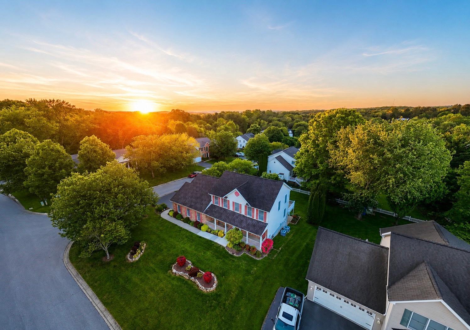 Every so often, a home comes along where the space feels less like compromise and more like freedom: thoughtful, useful, beautifully connected, and ready to adapt. And now that home has an improved price!

Tucked into Sykesville’s Quail Meadow neighborhood, this beautifully maintained Patton Homes residence offers 2,442 square feet above grade, plus 1,220 finished square feet on the lower level, with generous unfinished space for storage, mechanicals, hobbies, or future possibilities.

The layout is unusually versatile, featuring 5 bedrooms, 4 full baths, and 2 half baths, including two full bedroom suites on the main level and an additional primary suite upstairs. The main level also features wide doorways, while the large two-car garage includes an entry ramp and the rear deck offers ramp access to the outdoor living spaces, creating enhanced ease of movement throughout key areas of the home.
At the center of the home, the spacious kitchen offers abundant counter and cabinet space, granite countertops, stainless steel appliances, and low-maintenance wood-finish luxury vinyl plank flooring. It opens to a large family room, while the adjoining formal dining room brings in natural light and connects to the expansive Trex-style deck.

Outside, the deck leads to a screened-in gazebo with a ceiling fan and light, creating a memorable setting for crab feasts, relaxed evenings, or weekend gatherings. A covered patio below the deck, lush lawn, and beautifully landscaped grounds complete the setting.

With rare bedroom-suite flexibility, generous living areas, thoughtful accessibility features, and exceptional indoor-outdoor flow, this Quail Meadow home offers a level of possibility that is well worth experiencing in person. Schedule your exclusive tour today!