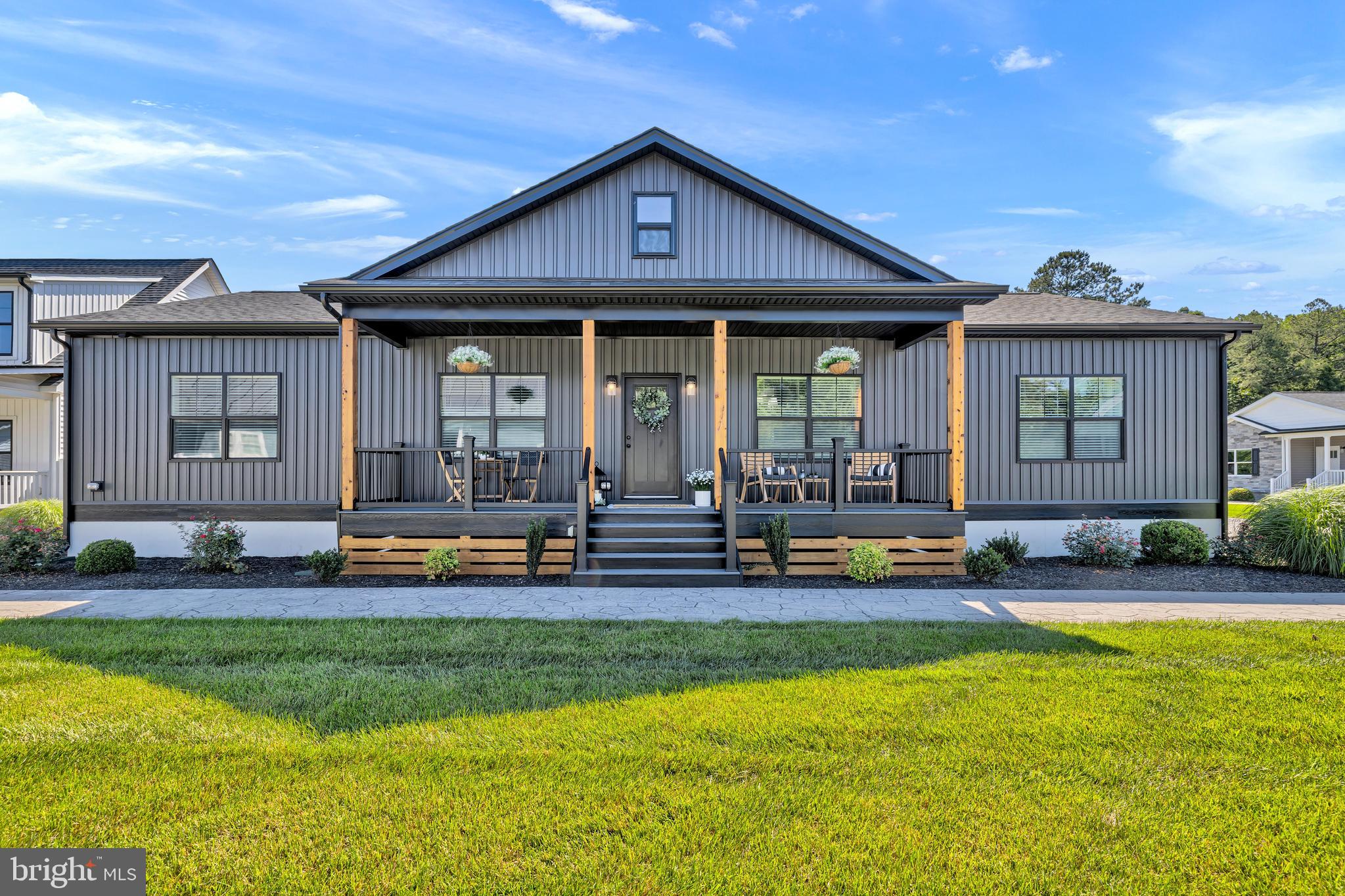4.76 ACRES! Stunning new construction just minutes from Lake Anna, showcasing modern farmhouse design and premium finishes throughout. The striking Slate siding, accented with wood columns and a welcoming 6' x 26' covered front porch, creates exceptional curb appeal. Inside, you'll find an open-concept floor plan featuring a spacious great room with coffered ceilings and a fireplace, designer kitchen with an oversized island, custom cabinetry, granite countertops, stainless steel appliances, and a dedicated home office. Luxury vinyl plank flooring, tray ceilings, and thoughtful craftsmanship enhance the home's appeal, while the private primary suite offers a beautifully tiled walk-in shower for a true spa-like retreat. Enjoy the perfect blend of style, comfort, and peaceful country living on 4.76 acres. Estimated completion is September 1. Exterior and interior photos are of similiar model.