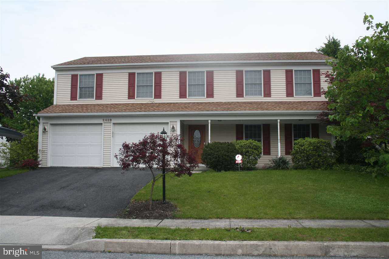 Plenty of space in this marvelous split level home. Four large BRs. One conveniently located on the main floor-(considered level 2)-was DR converted to a bedroom w/walk-in closet. Can always be put back to a dining room. Updated kitchen w/granite counters & stainless appliances. Enjoy the open feel of the family room w/vaulted ceiling & skylights. Built-in bookshelves line the living room walls. The deck is surrounded by a fenced yard & open space to the rear. Lots of storage in basement & 2 car garage.