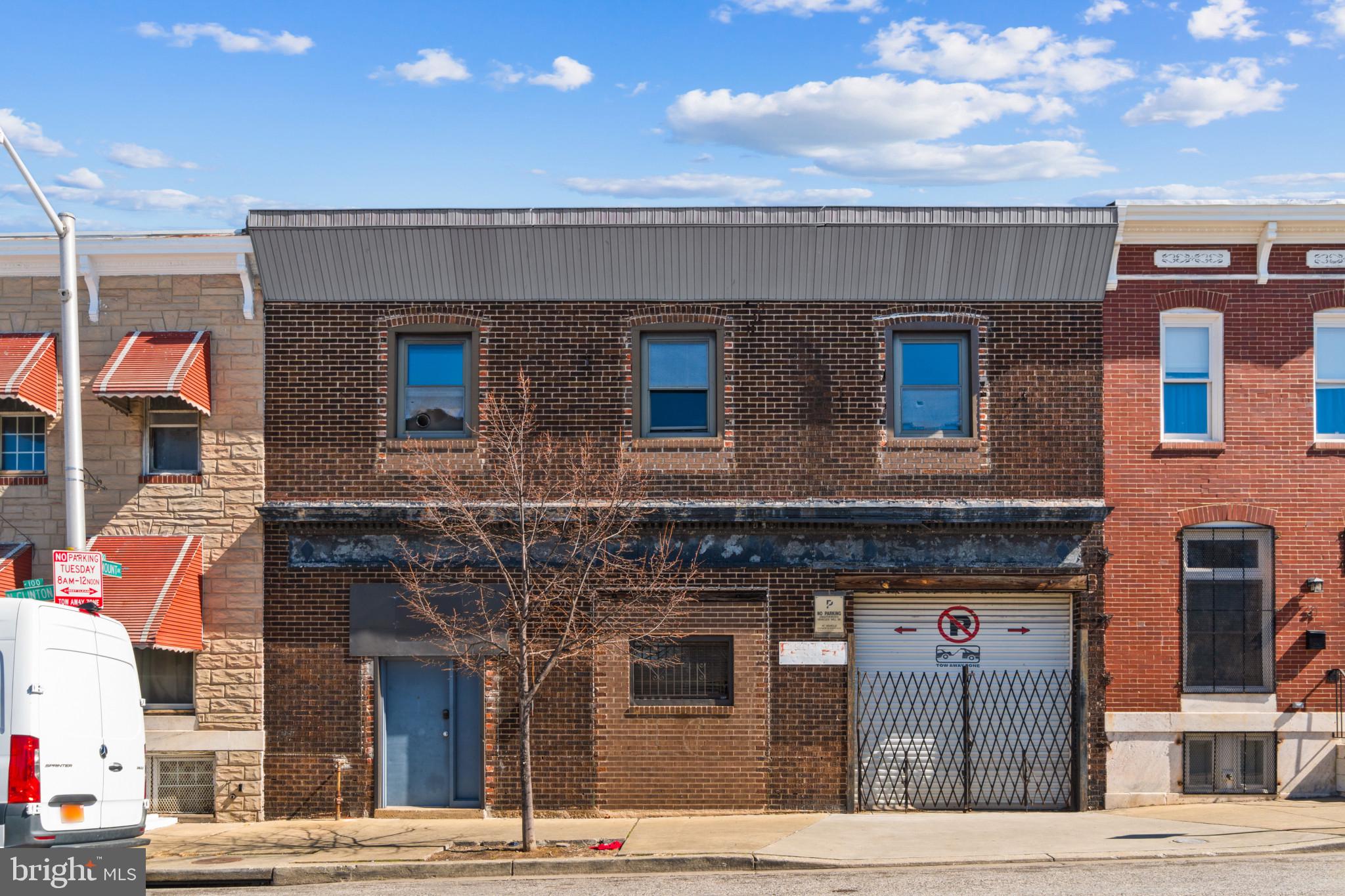 Unique development opportunity for this double wide property with PARKING current used as a giant warehouse with private offices and 2 bathrooms. Items in property do NOT convey and will be removed prior to closing. Property comes with 2 bathrooms. Endless potential!