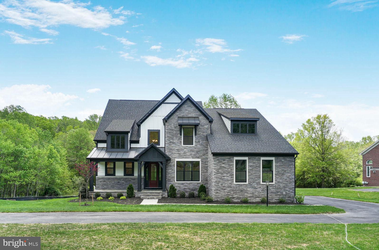 Beautifully appointed Sycamore home available for quick move-in at Stuart Mill! The open and airy main living level features an impressive kitchen with adjacent dining area, a separate study, a spacious dining room, and a huge great room that has a gas fireplace and sliding glass doors that open to the covered outdoor living. The Chef’s dream kitchen features Gunny cabinets, Calacatta Gold quartz countertops, a large island with waterfall, KitchenAid stainless steel appliances, and an enormous walk-in pantry.  The Kitchen also has a prep zone that connects the kitchen and dining room.  Upstairs you’ll find a luxurious primary suite featuring a large bedroom with tray ceiling, two huge walk-in closets, and its own private terrace. The second floor also has a secondary bedroom with private bath, two additional secondary bedrooms with Jack and Jill bath, a sizeable laundry room, and a cozy loft.  The lower level offers a large, finished rec room, an additional full bath, and a walkout.
