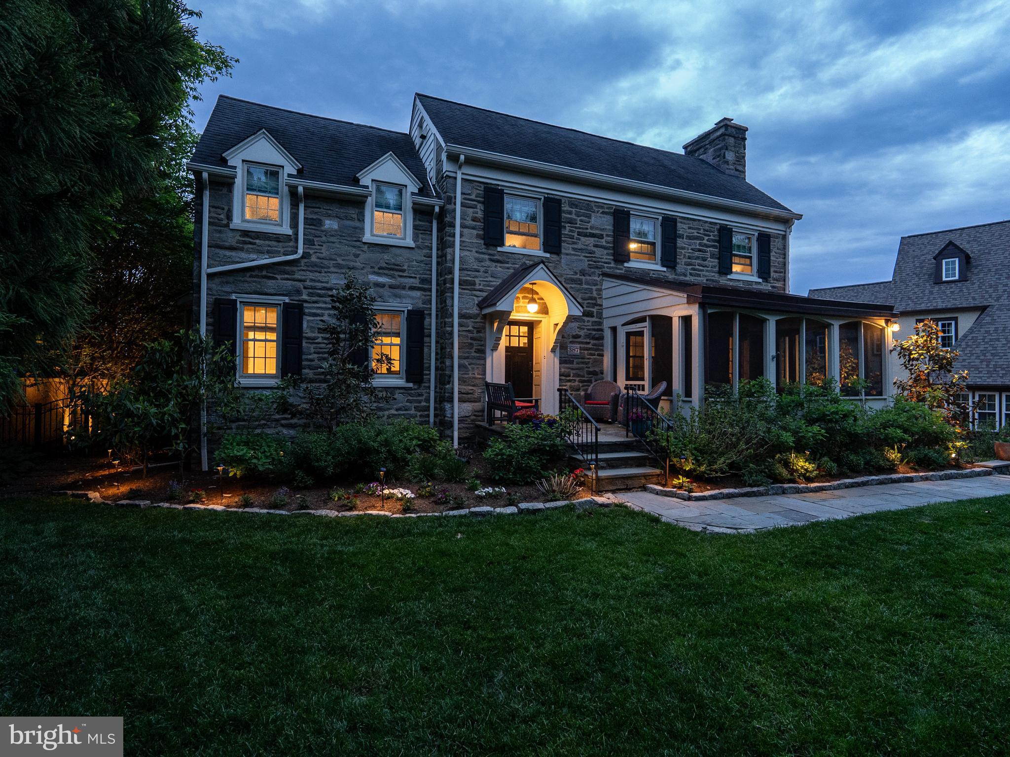 Welcome to 387 Penn Road, a beautifully updated center-hall stone Colonial blending classic Main Line character with thoughtful improvements.

Ideally located in the heart of Wynnewood and built in 1937, this gracious home offers timeless architectural details, generous proportions, and exceptional flexibility for modern lifestyles. From the moment you arrive, you’ll notice the home’s gorgeous curb appeal, with professional perennial landscaping, a flagstone walkway, stone retaining walls, and a charming covered entry with a copper roof and newer front door (2018).

Inside, rich hardwood floors, deep windowsills, and original staircase details create warmth and character throughout the traditional center-hall layout. The nicely-sized living room with a wood-burning fireplace, elegant dining room with built-ins, and inviting, cozy family room provide comfortable everyday living and effortless entertaining. The screened-in front porch, enhanced with a copper roof (2022), offers the perfect place for morning coffee, evening cocktails, or relaxing with loved ones.

The fully remodeled eat-in kitchen, completed in 2022, serves as the heart of the home, featuring granite countertops; abundant cabinetry; a large island, gas stove with range hood, counter-depth refrigerator, and built-in microwave; a convenient secondary stairway to the second floor; and access to the backyard and patio.

Upstairs, you will find four spacious bedrooms on the second floor, including a generously sized primary suite with a walk-in closet and beautifully renovated en suite bathroom. An updated hall bathroom, with a shower-tub combination, completes the second floor. The third floor offers a flexible living space with a fifth bedroom, full bath, and bonus room; it’s simply perfect as an au pair suite, guest retreat, home office, or creative studio. 

The fully finished walkout lower level significantly expands the home’s functionality with a second kitchen, a full bath with a step-in shower, and a recreation room; just think of its potential as a home gym or theater, or as accommodations for long-term guests or multi-generational living. Also on the lower level, a thoughtfully designed mudroom with built-in storage, laundry, and a dog wash station connects directly to the attached garage.

Outside, the fully fenced yard and gated driveway offer privacy and peace of mind, while the rear patio, privacy fences, and mature landscaping create a serene setting for outdoor living and entertaining. Professional exterior lighting beautifully enhances the property in the evening hours. Ample driveway parking plus a garage provide room for everyone and everything.

Located in Lower Merion Township and served by Penn Valley Elementary and Welsh Valley Middle School, high school students at this address may choose between Lower Merion and Harriton through the district’s Choice Zone program.

Enjoy an exceptionally convenient lifestyle just minutes from the Wynnewood and Ardmore train stations, Whole Foods, Suburban Square, Trader Joe's, Narberth, public parks, playgrounds, libraries, dining, shopping, and major commuter routes to Center City Philadelphia and beyond.

Don’t miss the list of recent improvements, including a whole-house water filtration system (2025)!

This home checks all the boxes and more! Schedule your private tour today. Floor plans are deemed reliable but not guaranteed. Buyer to verify square footage. Showings begin Friday morning, June 19th.