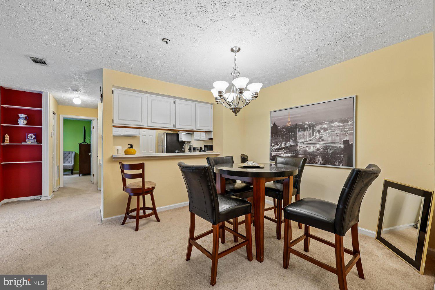 Discover an exquisite 2-bedroom, 2-bathroom residence in the prestigious Waters Edge at North Lake. This elegant unit features a spacious layout with plush carpeting and a cozy fireplace, perfect for intimate gatherings. The modern kitchen is equipped with high-end appliances, including a built-in range, electric oven, and dishwasher, ensuring culinary excellence. Enjoy the convenience of in-unit laundry facilities and a stall shower in the bathrooms. Set on a level lot with year-round access, this property offers serene views of lush trees and woods, enhancing your tranquil lifestyle. The community boasts a luxurious pool, ideal for relaxation and socializing. Located near the picturesque lake, this home provides an exclusive retreat while remaining accessible to local amenities. Experience the perfect blend of comfort and sophistication in this charming garden-style apartment, where every detail caters to a refined living experience.