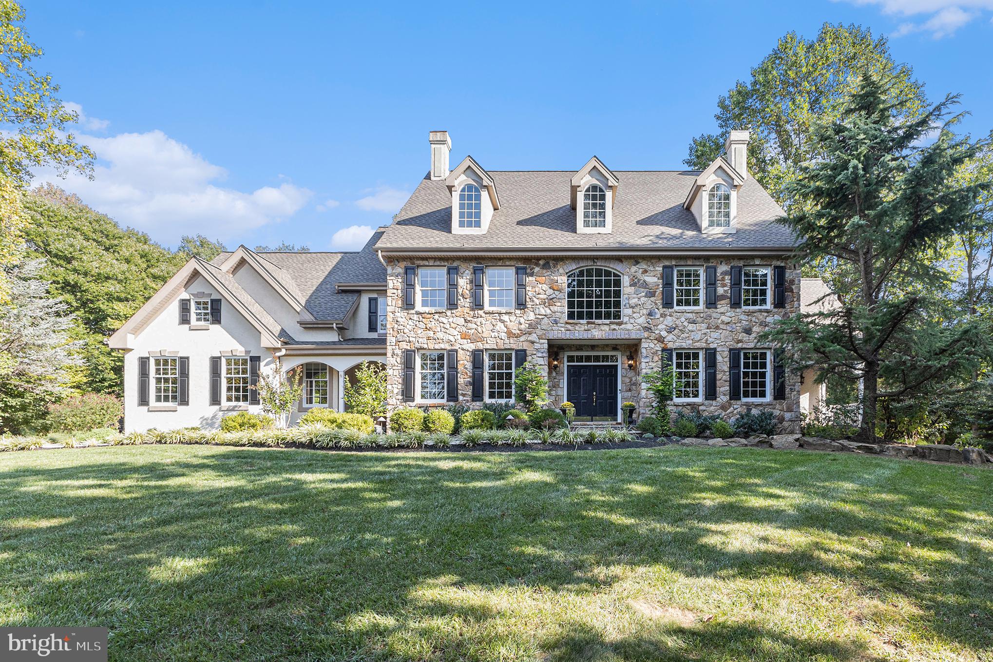 Welcome to this exquisite Wilkinson-built home, nestled on a sprawling 2.5-acre lot within the prestigious White Clay Glen neighborhood of Landenberg, PA. Located on a private cul-de-sac, this stunning stone and stucco exterior has been professionally remediated and complements its natural surroundings beautifully. This home now features a brand-new septic system, offering peace of mind for years to come.  Boasting over 6,000 square feet of meticulously maintained living space, this home offers four spacious bedrooms, four full bathrooms, and two half baths, along with a fully finished daylight walkout basement. From the moment you arrive, you'll be captivated by the impressive stone façade and the beautifully landscaped grounds that enhance the property’s curb appeal.  Upon entering, the two-story foyer and its grand staircase set the tone for the sense of luxury and space that defines this home. The main level features expansive living areas adorned with high-end finishes and thoughtful design elements, including upgraded trim work in the formal living and dining rooms.  The gourmet eat-in kitchen is a chef's dream, featuring a walk-in pantry, butler’s pantry, a Thermador gas stove and oven, plus new stone countertops and backsplash. The oversized island, which seats four, serves as the heart of the kitchen and flows seamlessly into the inviting two-story family room. Here, a wall of windows and a custom stone gas fireplace create a warm and welcoming atmosphere.  A private home office with custom built-ins is perfect for today’s work-from-home lifestyle. The cheerful sunroom is awash in soft natural light—perfect for plants and a bright, quiet place to relax. Additional highlights on this level include two powder rooms, an oversized laundry room with a convenient laundry chute from the second floor, and a well-appointed mudroom.  Upstairs, the luxurious primary suite offers a serene retreat with a tray ceiling, a spacious sitting room, walk-in closets, and a spa-like bathroom featuring a tiled shower, soaking tub, and dual vanities. The second bedroom includes its own ensuite bathroom and walk-in closet, while the third and fourth bedrooms share a well-designed Jack-and-Jill bathroom.  The full finished basement is an entertainer’s paradise—simply enormous. You'll enjoy a theater room, an exercise room, a kitchenette, a full bathroom, a cozy sitting area with a wood stove, and ample storage space.  This remarkable property borders the White Clay Creek Preserve, offering easy access to a wonderful network of maintained trails, perfect for outdoor enthusiasts. With a new septic system and professionally remediated stucco, this exceptional home is truly move-in ready and built to impress.