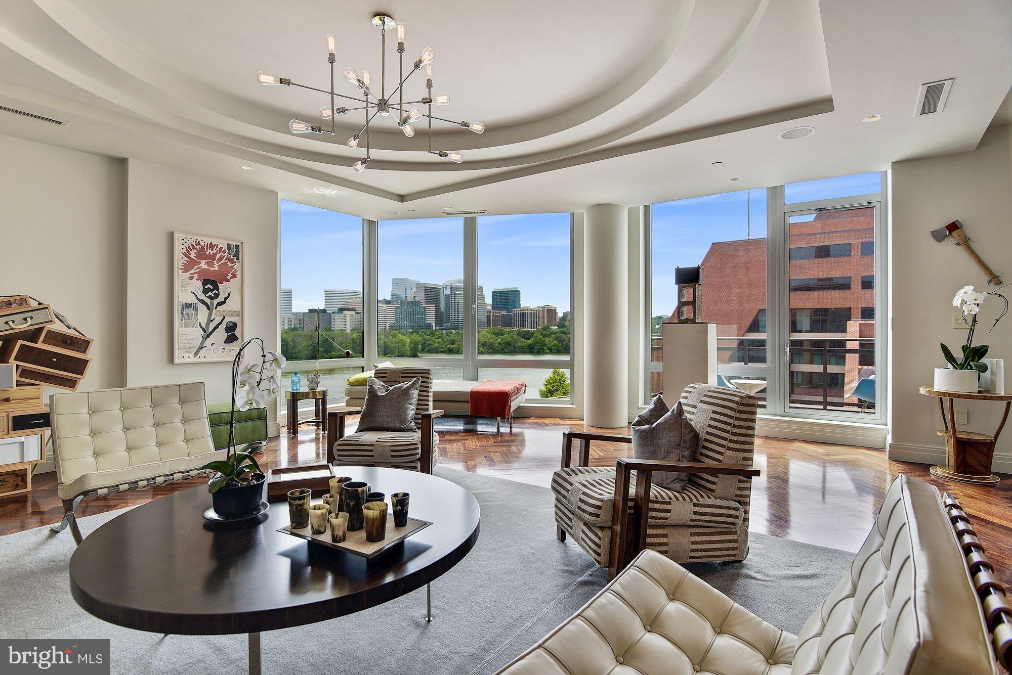 Rarely available, this exquisite penthouse in The Residences at The Ritz-Carlton, Georgetown, is a privilege to present. With three bedrooms, four full and one-half bathrooms and 3,050 square feet, the property features 10’ high ceilings and Brazilian cherry hardwood floors. Expansive windows overlook the Potomac River where an ever changing landscape captivates all year long. The open living and dining room areas access a private balcony overlooking the Potomac. Two full bathrooms, a walk-in, custom closet, and a beautifully appointed bedroom form the sumptuous primary suite while two additional bedrooms also offer en-suite bathrooms and generous closets. Known worldwide for its legendary services, The Residences at the Ritz- Carlton, Georgetown feature 24-hour concierge, valet parking for owners and guests, security and hotel services. While located in the heart of bustling Georgetown near premiere boutique shopping, restaurants and entertainment, this property is a tranquil retreat where effortless, refined living is gracefully achieved.