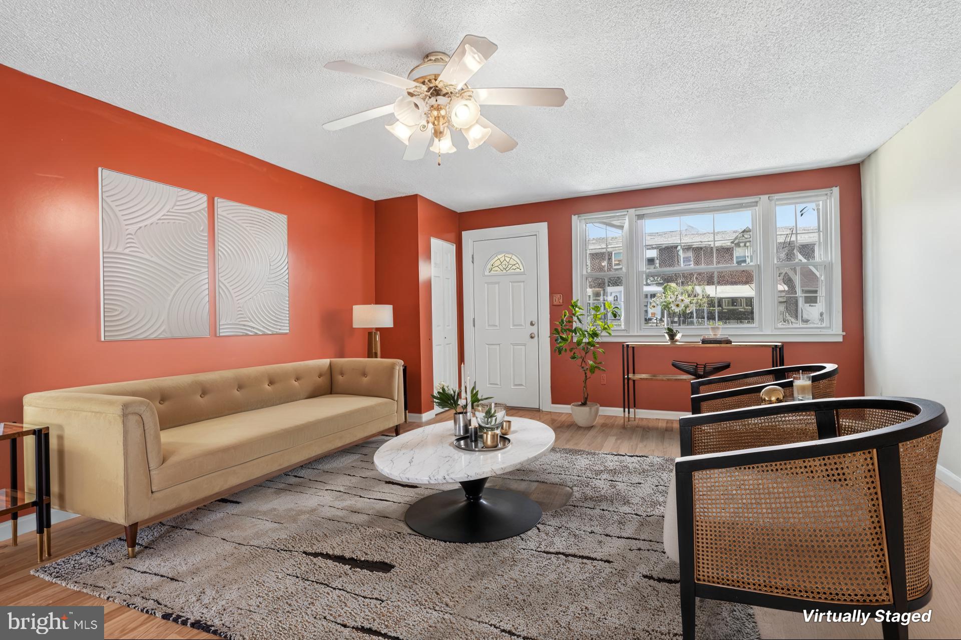 Welcome to this well-maintained, move-in ready 3-bedroom rowhome in the desirable Holmesburg section of Philadelphia, offering thoughtful upgrades, an attached garage, and a finished basement for added versatility. Approaching the home, discover the charming brick and stone exterior and spacious front patio. Inside, discover a bright and inviting living and dining area filled with natural light, creating an ideal space for both everyday living and entertaining. The upgraded kitchen features stainless steel appliances, ample cabinet space, and a functional layout designed for convenience. Upstairs, you'll find three spacious bedrooms along with a full bathroom in the hall. The finished walk-out basement expands your living space with endless possibilities for a family room, recreation area, home office, or guest space, and also includes a second full bathroom, laundry room,  direct access to the attached garage as well as the spacious rear driveway. A fantastic opportunity combining comfort, space, and move-in-ready convenience. Mortgage savings may be available for buyers of this listing.