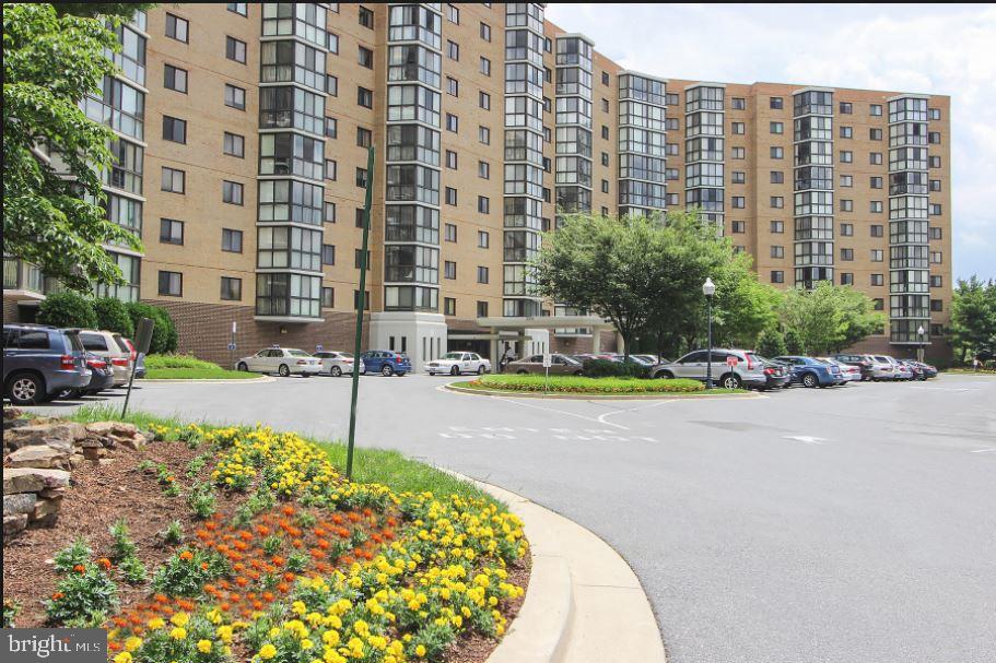 Large, light-filled, tastefully renovated one bedroom with den/solarium in excellent condition. Extra-large bedroom and eat-in kitchen. Spectacular, unobstructed penthouse views of the parkland, downtown Silver Spring, down to Washington DC cathedral. Closets galore. Hardwood and marble floors. Updated appliances, including full-sized washer and dryer. Immaculately clean. Very quiet, private corner unit. Garage parking included.  Senior citizen community of Leisure World with many amenities. A lovely home.