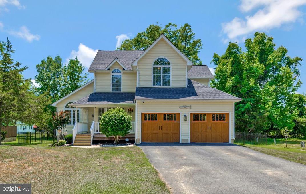 Welcome to your turn-key coastal retreat in the coveted Cove Point Beach Community! This beautifully expanded 4-bedroom, 2.5-bathroom home offers effortless beach living just 1.5 blocks from the private shores of the Chesapeake Bay. The light-filled, move-in-ready floor plan boasts a seamless 2022 addition featuring vaulted ceilings, a cozy family room fireplace, and a gorgeously renovated kitchen (Oct '22) with a state-of-the-art whole-home water filtration system.   

Step outside to your fully fenced-in private oasis, complete with a screened-in porch, expansive concrete patio, brand-new deck (Apr '23), outdoor shower, and a relaxing hot tub, plus a spacious shed for extra storage. Enjoy peace of mind with recent big-ticket updates including a brand-new roof (Apr '23), an eco-friendly septic system, and a recently replaced water heater. Complete with a huge 2-car garage—featuring new doors—for your golf cart and beach gear, plus an incredibly low HOA of just $180/year. Perfectly situated near Solomons Island, this is the ultimate year-round haven, vacation rental, or weekend getaway!
