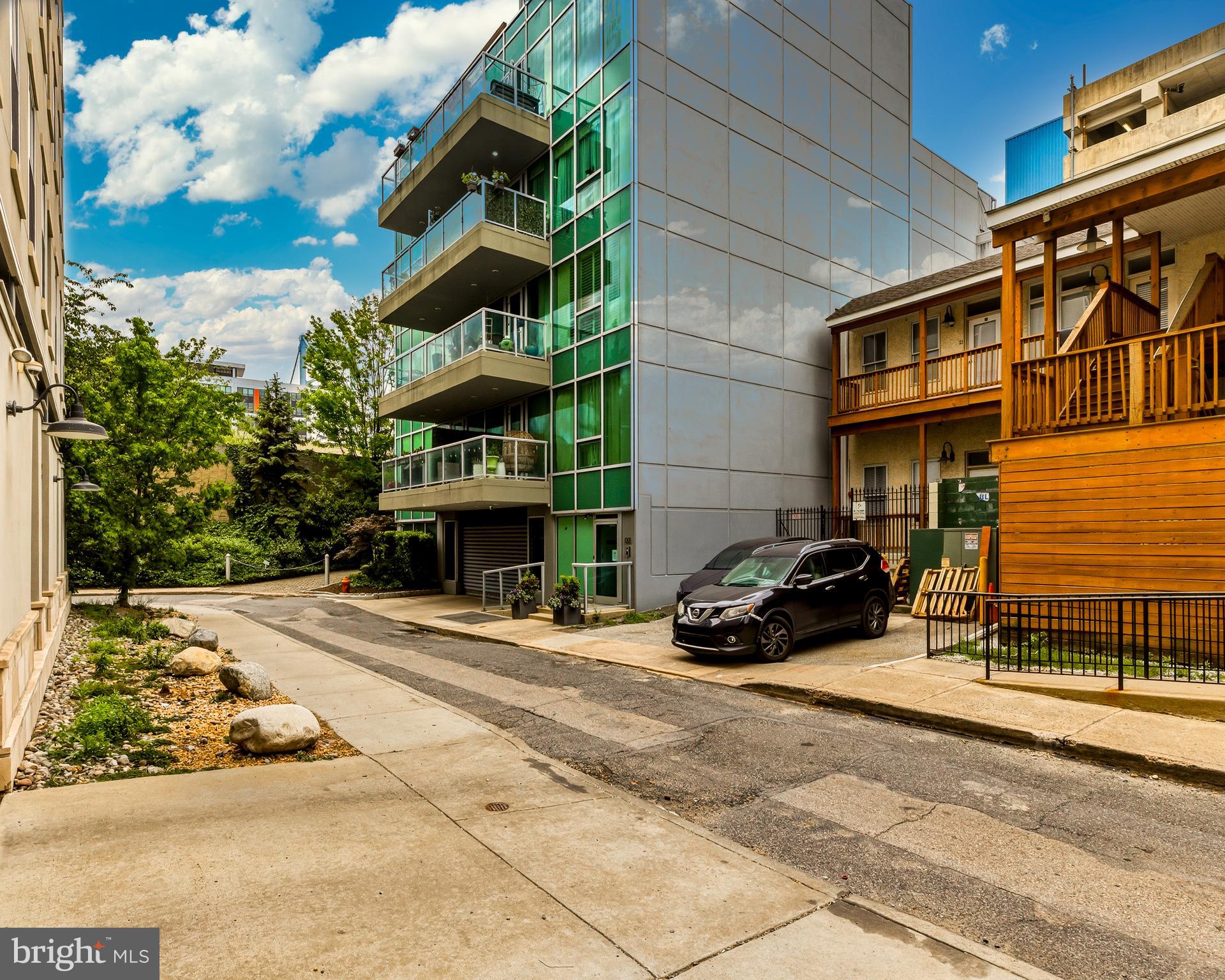 Welcome to elevated city living at its finest in Old City. Situated in the boutique and highly sought-after 122 New Street "NOUVEAU CONDOMINIUMS" building, Unit 4D delivers a rare blend of modern luxury, designer finishes, and private urban retreat-style living.

This impeccably customized residence showcases an open-concept floor plan with dramatic designer décor, rich flooring throughout, soaring ceilings, recessed lighting, and oversized windows that create an inviting and sophisticated atmosphere. The expansive living area features a stunning modern fireplace with concrete mantel as the main focal point, custom accent walls, and seamless flow into the gourmet chef’s kitchen.

The spectacular kitchen was designed to impress with sleek high-gloss cabinetry designed by Poggenpohl, premium Miele stainless steel appliances, gas cooking, double wall ovens, dramatic waterfall quartz countertops and matching full-height backsplash, oversized island seating, and designer lighting throughout.

The spacious primary suite offers a luxurious retreat complete with custom built-in storage, dramatic designer wall treatments, and access to a spa-inspired bathroom featuring a freestanding soaking tub, oversized rainfall shower, upscale tilework, and contemporary fixtures. A stylish 2nd ful bath/powder room adds convenience for guests.

Additional highlights include:
• Private covered balcony for outdoor relaxation
• Dedicated office/flex space ideal for remote work or creative use
• In-unit laundry with Miele stackable washer and dryer   
• Secure elevator building with controlled access
• Garage parking with one designated/deeded parking spot and bicycle storage
• Private and secured, beautiful landscaped common outdoor green space and garden areas

Perfectly positioned in one of Philadelphia’s most vibrant neighborhoods, residents enjoy immediate access to award-winning restaurants, nightlife, coffee shops, galleries, boutiques, Penn’s Landing, and major commuter routes.

A truly one-of-a-kind luxury residence offering style, sophistication, and convenience. Nouveau condominiums is pet friendly located in the heart of Old City, walking distance to some of Philadelphia's best boutiques, cafes, restaurants, hotspots, historic sites, theaters,parks, Penns Landing with easy access to the major highways of Interstate 95, Route 676, Route 76 and the Ben Franklin Bridge to name a few. Don’t wait to make your appointment to tour this gorgeous condo today!!