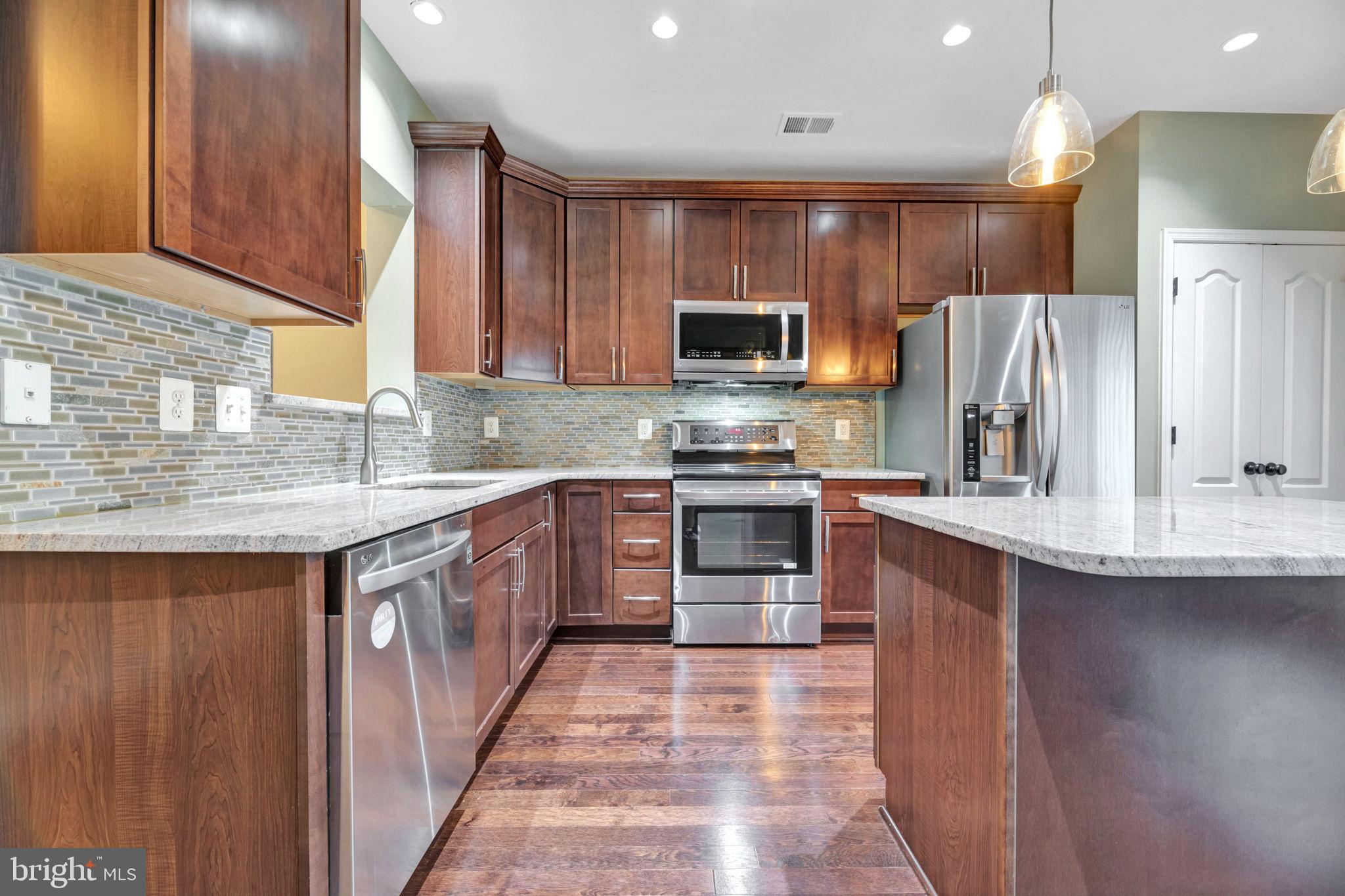 Come see this stunning end unit townhouse in a gate community. Laminate flooring on main level!  Open concept kitchen with granite counters. True master bedroom with walk-in closet with a double sink master bathroom with a sunk in tub and private shower. Washer and dryer on upstairs living level. There is a New HVAC system and New water heater. Location location location! There is metro access 2 minutes away and restaurants in walking distance.