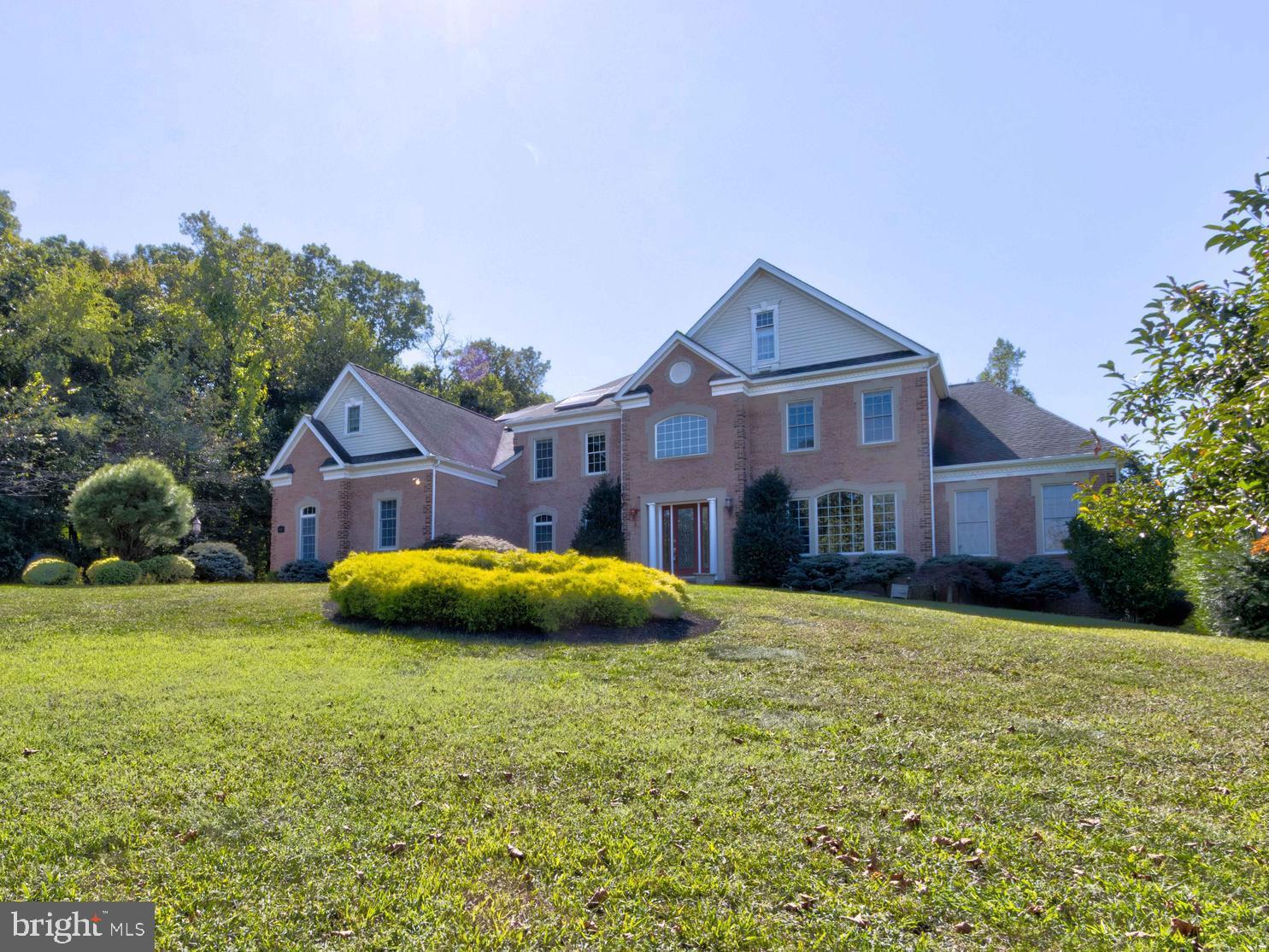 Beautiful 3 sided brick Colonial  in  the sought after The Reserve at Triadelphia Crossing community.  Curved double staircase with 2 story foyer and family room.   10 ft ceiling on 1st floor and 9 ft ceiling on 2nd floor and LL.  Large gourmet kitchen with SS appliances, breakfast area and sunroom off kitchen.  Large Solarium is great for gathering entertainment.  The entire 1st and 2nd floor has hardwood flooring.  Primary suite has sitting area, bedroom, large bathroom, two walk in closets.  Every bedroom on 2nd floor has own full bathroom.   Walkout basement has two large recreation rooms, two additional bedrooms with a full bath.  3 car side loaded garage.