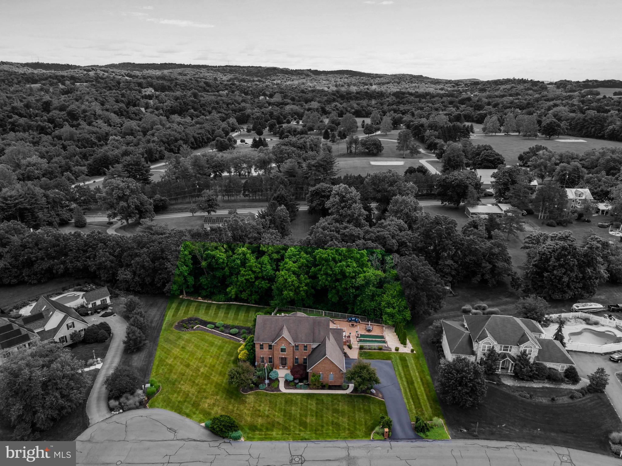 Location is everything, and this exceptional Mechanicsburg property delivers! Ideally situated just steps from Lower Allen Park and Liberty Forge Golf Course, this beautifully maintained home offers an incredible combination of space, luxury, and outdoor living.From the moment you enter, you'll be welcomed by a grand two-story foyer that sets the tone for the thoughtful details found throughout. The main level features a formal dining room, private home office, convenient laundry room, and a versatile billiard room that could easily serve as a formal living room, playroom, or flex space. The spacious eat-in kitchen is the heart of the home, boasting updated quartz countertops and overlooking the expansive deck complete with a motorized awning—perfect for relaxing or entertaining.Step outside and discover your own private backyard retreat. Enjoy summer days by the heated saltwater pool featuring a newer liner, pump, and filter, or sharpen your short game on not one, but two private putting greens. Gather around the fire pit surrounded by extensive hardscaping, while the generous side yard provides ample space for recreation, sports, or simply enjoying the outdoors.Upstairs, escape to the updated primary suite featuring a beautifully remodeled bathroom with a stunning new shower and updated vanities. Three additional bedrooms and a convenient Jack-and-Jill bathroom complete the upper level.Need even more space? The finished walkout basement offers endless possibilities for a home theater, gym, game room, or additional living area, plus the convenience of an additional half bath.Additional updates include a geothermal heating and cooling system, new flooring, and fresh landscaping—making this home truly move-in ready just in time for summer.A rare opportunity to own a home that combines an unbeatable location, exceptional outdoor amenities, and versatile living spaces. Schedule your private showing today!