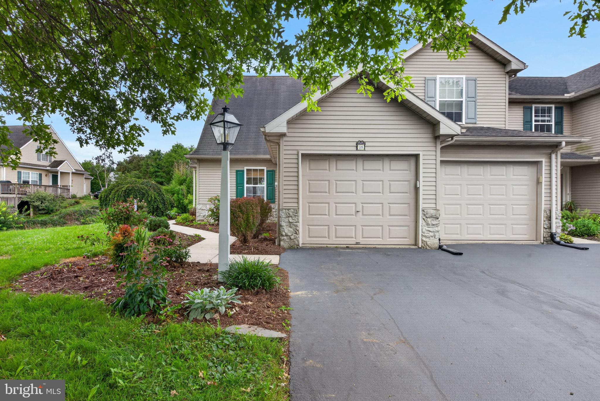 Welcome home to this wonderful end-unit townhome tucked into a quiet cul-de-sac in the popular Warwick School District, just minutes from downtown Lititz! This one-floor-living  offers a laundry room, spacious primary bedroom with a walk-in closet and private primary bath, all conveniently located on the main level. Upstairs, you'll find two generously sized bedrooms plus a full bathroom, offering plenty of space for family, guests, or a home office. Economical natural gas heat and central air keep things comfortable year-round, while off-street parking makes coming and going a breeze. Downstairs, the finished lower level really shines with a walk-out daylight basement leading to a cute patio, plus a cozy family room and a versatile bonus room perfect for a home office or additional bedroom. Step outside from the living room onto the sweet Trex deck, complete with a pergola, and soak in the morning sun. A new roof is set to be installed mid-September, giving the next owner even more peace of mind. Don't miss this rare opportunity to enjoy easy, low-maintenance living in a fantastic Lititz location!