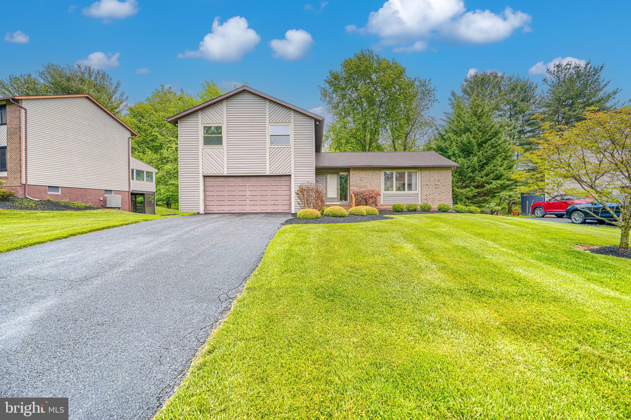 ***Buyer got cold feet. Never completed inspections***Beautifully updated 4BR/2.5BA split-level in desirable Velvet Hills! This meticulously maintained move-in ready home features brand new hot water heater (2026), fresh paint (2025), new carpet (2024), upgraded insulation, and extensive updates throughout. The upgraded kitchen offers granite countertops, stainless Whirlpool appliances, tile backsplash, coffee bar, pantry, recessed lighting, skylight, eat-in table space, and sliding door to the expansive deck, making it the perfect entertainment space. Hardwood floors and recessed lighting highlight the living and dining rooms, while the sunken family room features custom built-ins, an electric fireplace and access to the patio. The primary suite includes customized closets, new ceiling fan, and a fully remodeled spa-inspired bath (2025) with heated tile floors, marble vanity, oversized walk-in shower with rain head, handheld sprayer, built-in seat, and barn-style custom glass doors. All the 2nd floor bedrooms include ceiling fans and updated closet systems. The finished lower level offers additional recreation space, storage galore, natural light and another walk out to the back yard. Additional highlights include an epoxy-floor 2-car garage, alarm system, Ring doorbell, keyless entry pads, window treatments throughout, attic fan, recently cleaned ductwork, and all new windows on the 2nd level. Major exterior improvements completed in 2025 include new siding, roof, gutters, gutter guards, skylight, and flood lights. Water/sewer lines replaced in 2018; heat pump, sump pump replaced approximately 10 years ago.