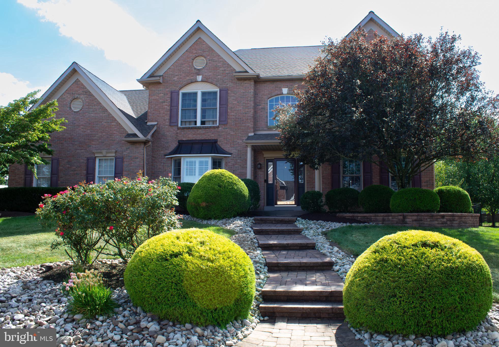 Welcome to this beautifully updated center hall colonial in the highly sought-after Estates of Warrington Ridge, a picturesque community known for its mature trees and established charm. Located within the award-winning Central Bucks School District and served by Kutz Elementary, Lenape Middle School, and Central Bucks West High School, this home also enjoys the convenience of a Warrington mailing address.
A paver walkway leads to the front entrance, while a brand-new roof (2025) and manicured landscaping create outstanding curb appeal. Inside, hardwood flooring, neutral paint colors, and thoughtful updates make this home truly move-in ready. The foyer is flanked by a private home office overlooking the front yard and a formal living room adorned with crown molding and chair rail accents. The living room flows seamlessly into the formal dining room, creating an elegant space for entertaining and holiday gatherings.
The heart of the home is the stunning kitchen, renovated in 2019 with timeless finishes including white cabinetry, nickel hardware, black leathered granite countertops, stainless steel appliances, recessed lighting, and a pantry for additional storage. The adjacent laundry room was also renovated in 2019 and features a Blanco sink, stackable washer and dryer, granite folding station, and updated powder room.
The kitchen opens to a spacious breakfast area and inviting family room featuring a gas fireplace, custom decorative wall paneling, and sliding glass doors leading to the backyard retreat.
Upstairs, the primary suite serves as a private sanctuary with vaulted ceilings, dual closets, and a separate sitting room ideal for a nursery, home office, or reading nook. The luxurious primary bath, completely renovated in 2025, offers a freestanding soaking tub, oversized walk-in shower, and linen closet. Three additional bedrooms provide ample space, while the renovated hall bath (2022) features a tiled walk-in shower, double vanity, and granite countertop. The fully finished, waterproofed basement expands the living space considerably and is designed for both entertaining and everyday enjoyment. Highlights include a custom bar with sink, a large media and gathering area, multiple bonus rooms ideal for fitness, gaming, hobbies, or play space, and abundant storage hidden behind finished walls, under the staircase, and within multiple closets. Convenient outdoor access offers flexibility for future living arrangements and additional improvements. The oversized two-car garage is equipped with built-in cabinetry, shelving, and organizational storage, while an additional outdoor refrigerator/freezer provides added convenience for entertaining.
Step outside and discover your own private backyard oasis. Surrounded by mature trees for exceptional privacy, the outdoor living space is designed for relaxation and recreation. A spacious screened porch with a vaulted ceiling and ceiling fan creates the perfect three-season retreat overlooking the backyard. Additional open-air wood decking, side yard space, vinyl railings, and illuminated stairs further enhance the outdoor experience. The centerpiece of the backyard is the heated in-ground pool featuring a sun shelf, brick coping, and cantilever decking, creating a low-maintenance resort-like setting perfect for summer gatherings and everyday enjoyment. Combining extensive updates, flexible living spaces, exceptional outdoor amenities, and a prime location within the Central Bucks School District, this remarkable home offers the lifestyle today's buyers have been waiting for. Professional Photos expected by June 25