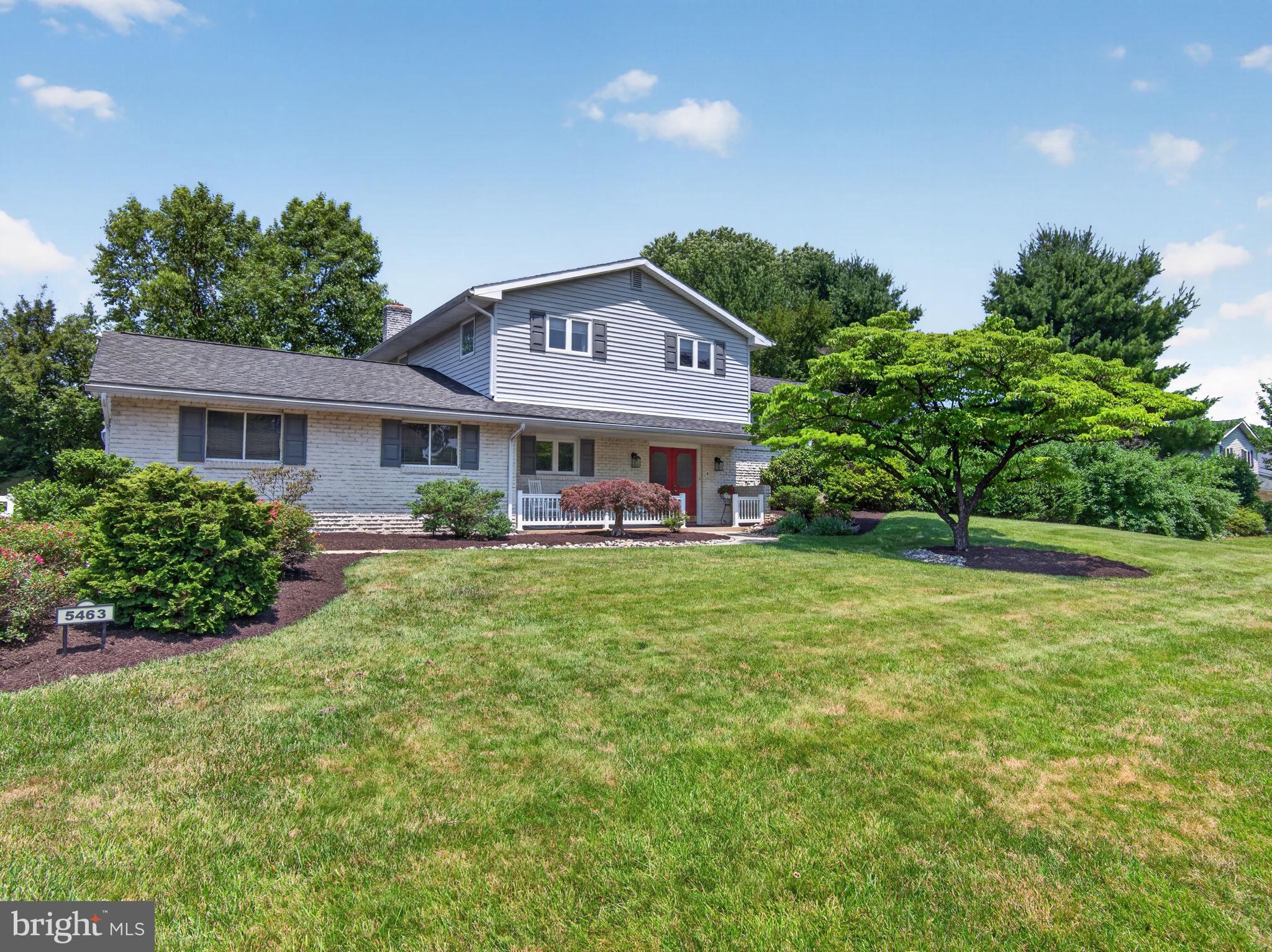Located in Parkland School District, this split-level home offers 3 bedrooms, 2 full bathrooms, 1 half bathroom, and over 2,800 square feet of finished living space. Set on a beautifully landscaped lot with two driveway access points, the property features a private backyard, deck, patio, and mature tree-lined surroundings. A covered front porch welcomes you into the foyer, where a private office with built-in shelving sits just off the entrance. The ground level features a spacious family room with exposed ceiling beams, recessed lighting, a floor-to-ceiling brick gas fireplace, and sliding glass doors leading to the patio and backyard. Also on this level is a finished flex space with its own private entrance, half bathroom, and direct access from the driveway. Currently used as a salon, the area offers flexibility to suit a variety of needs. A deep one-car garage and laundry area complete the level. The main living area features hardwood flooring throughout much of the space. A bright living room with a large bay window opens to the dining area with access to the rear deck. The kitchen offers granite countertops, stainless steel appliances, a breakfast bar, recessed lighting, and a deep window overlooking the backyard. Upstairs, the primary bedroom includes hardwood flooring, dual closets with mirrored doors, and a private en suite bathroom. Two additional bedrooms and a full bathroom with a double vanity and skylight complete the level. Outside, enjoy a private, tree-lined backyard with mature landscaping, a spacious deck, and a patio offering multiple areas for outdoor entertaining and relaxation. A deep one-car garage, flexible layout, and convenient Parkland School District location complete the property.
