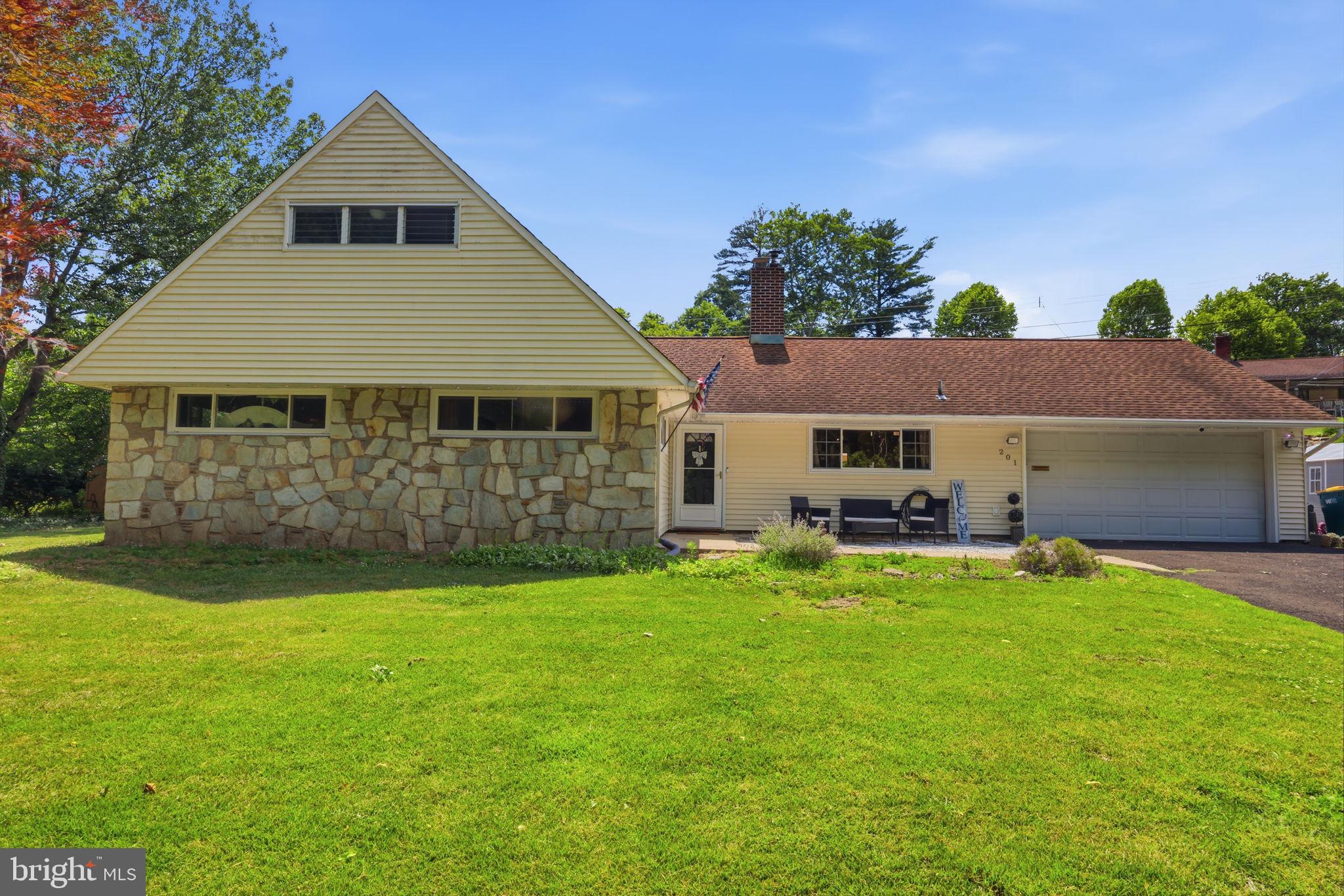 201 Snowball Drive offers a rare combination of space, flexibility, and setting in Levittown's desirable Snowball Gate neighborhood. Positioned across from open green space and surrounded by mature landscaping, the property enjoys a true park-like setting that creates a sense of privacy and openness rarely found in the area. Inside, the layout is designed for comfortable living with spacious gathering areas and plenty of room to spread out. The main living room is centered around a decorative fireplace that adds character and serves as a natural focal point. Just beyond, a large family room addition at the rear of the home provides valuable extra living space, ideal for entertaining, relaxing, or everyday use. The kitchen offers generous cabinet storage and an efficient layout that connects easily to the dining and living areas. Three bedrooms are conveniently located on the first floor, creating the option for true one-level living. Upstairs, you'll find a fourth bedroom along with a versatile bonus space that can serve as a home office, playroom, hobby room, or additional living area. Outside, the park-like grounds provide room to garden, play, entertain, or simply enjoy the peaceful surroundings. The large two-car garage offers ample space for parking, storage, and projects. Located within the Neshaminy School District and just minutes from Route 1, I-95, the Pennsylvania Turnpike, shopping, dining, and SEPTA Regional Rail service, this location provides convenient access throughout Bucks County, Philadelphia, and New Jersey. Offering a unique combination of living space, functional updates, and outdoor enjoyment, this home delivers the flexibility today's buyers are looking for. Schedule your private showing and experience all it has to offer.