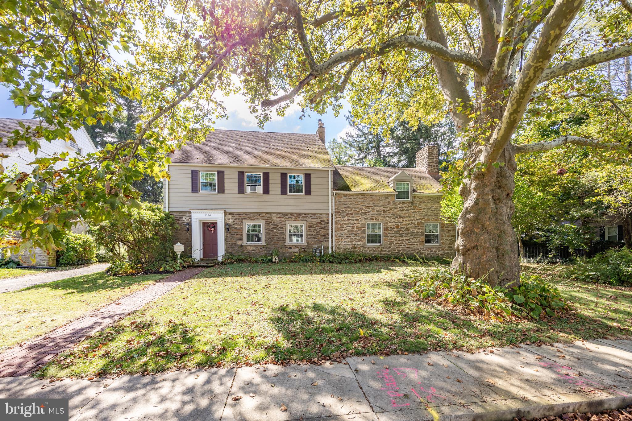 Step into a piece of history with this beautiful  5 bedroom, 3.5-bath stone home, originally built in 1924 and filled with timeless character and modern updates.  A charming brick walkway, graceful arched room entries, deep windowsills, curved walls, handcrafted moldings, custom  built-ins, and two inviting fireplaces showcase the home's remarkable craftsmanship. The heart of the home is the updated kitchen and dining area, featuring abundant cabinetry, stainless steel appliances, and generous workspace, making it ideal for everyday living and entertaining. The first floor also features a large living room and dining room as well as a half bath.  The second floor offers four generously sized bedrooms and two full bathrooms, while the third floor features an additional bedroom and full bath, creating endless possibilities for a guest suite, home office, playroom, or private retreat.  Relax year-round in the spacious three-season porch complete with a hot tub, or step outside to your private backyard where you'll find a large patio with built-in seating and a fire pit—perfect for hosting gatherings or enjoying peaceful evenings under the stars. A storage shed provides additional space for lawn equipment and outdoor essentials. An unusual feature of this home is the abundance of storage space with plenty of closet space and an unfinished basement. Additional highlights include a detached two-car garage, mostly newer windows, and the peace of mind of a recent conversion from oil to natural gas heat. A one-year home warranty is also included. Ideally located with easy access to major transportation routes, this exceptional home offers the perfect blend of historic elegance, modern convenience, and inviting indoor and outdoor living spaces. Don't miss the opportunity to make this one-of-a-kind property your own. Interior Photos will be posted Thursday