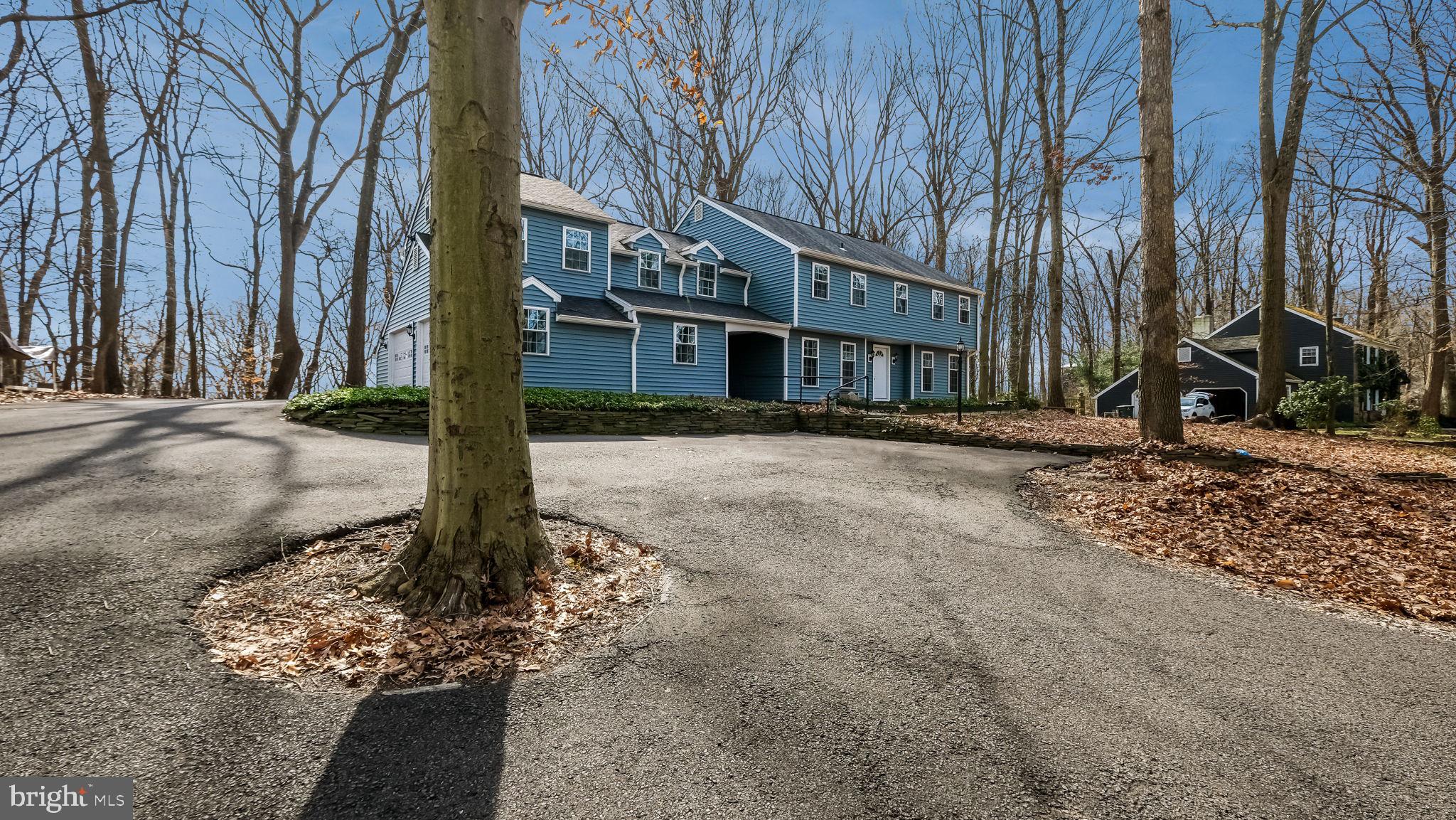 You must see this wonderful home! Why buy new? Within the past 3 years almost everything has been replaced!   The truly tranquil and bucolic wooded 1.25 acre lot  is where this 4400sf 5 bedroom 3.5 bath home sits on Private Drive. Wonderful views out of every window.  From the second floor you can view the  Peddler's Village holiday lights and fireworks! The roof, siding, windows, doors, subfloors, flooring, HVAC, boiler, baseboards , radiant floor heat, oil tank, well equipment, plumbing, lighting, electrical, bathrooms, cabinets, appliances, even the drywall and more were all installed between 2021-2022